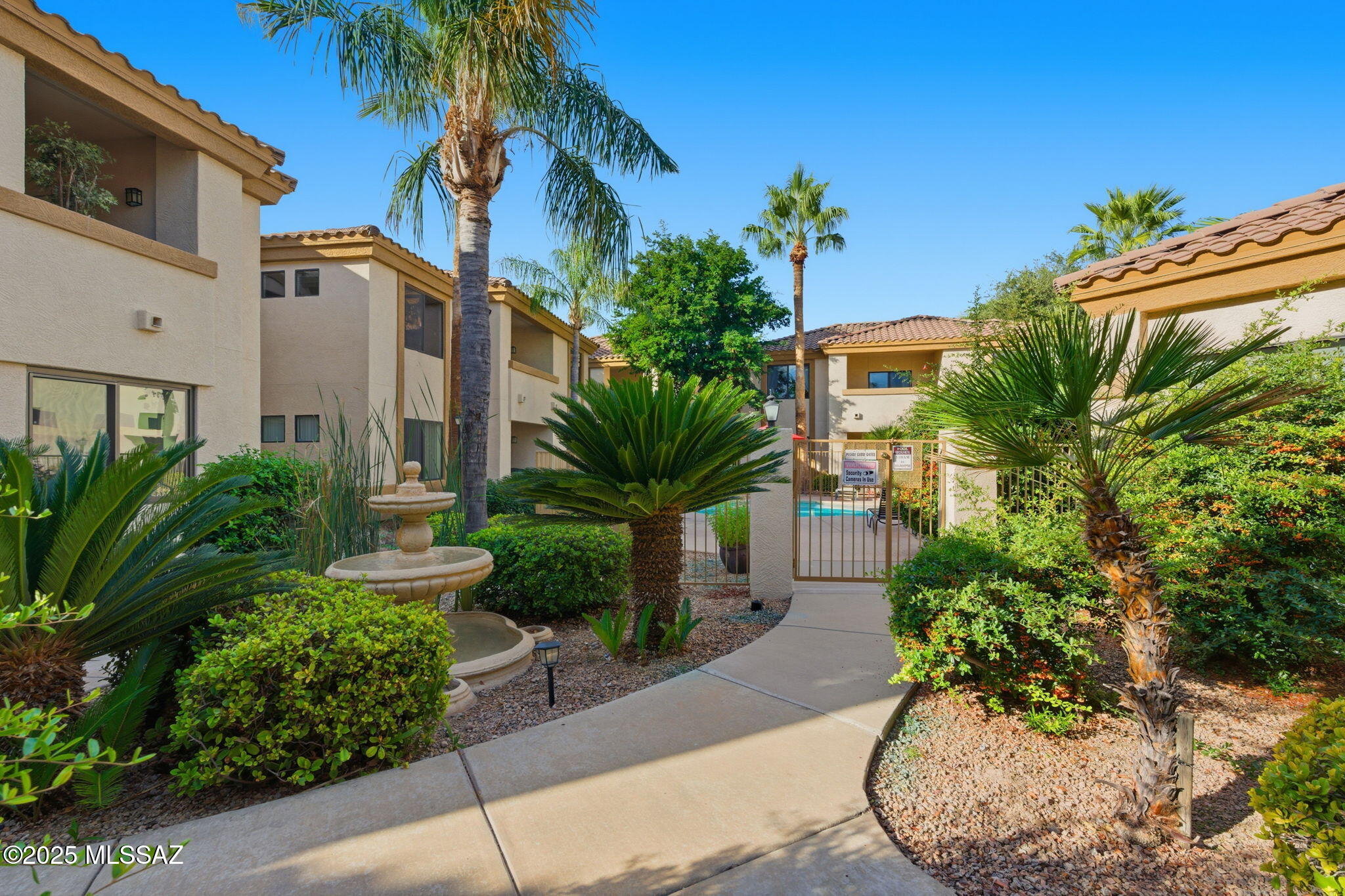 Enjoy low-maintenance living in this spacious 3-bed, 2-bath condo in a gated community with direct access to The Tucson Loop—miles of paved trails for biking, walking & running. The split floor plan offers privacy & functionality with all-tile flooring—no carpet! Amenities include a pool, spa, fitness center & rec room, all in beautifully maintained surroundings. Close to restaurants, shops & entertainment. HOA covers trash, water, roof repairs, pest control & blanket insurance for true lock-and-leave convenience. Perfect as a full-time home, winter getaway or investment!
