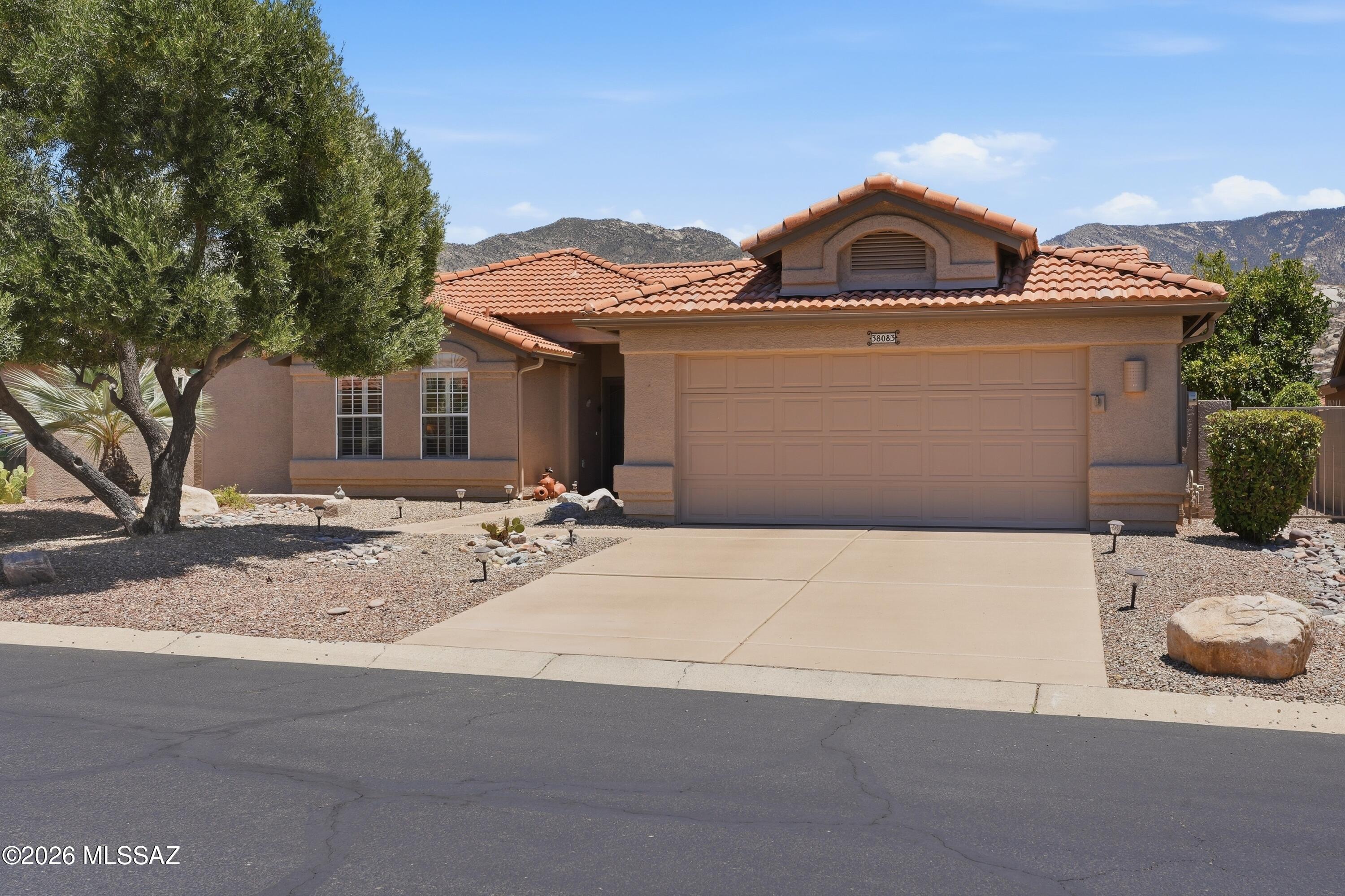 Live the ultimate, Sonoran Desert lifestyle, with mountain views in this beautifully situated single-story residence, perfectly positioned close to the lush fairways of Saddlebrooke (a 55+active adult community!) Spanning a generous 2,209 square feet, this 2BD/2BA+ an office, classic desert home seamlessly captures the casual elegance of Southern Arizona, framing sweeping morning sunrises right from your main living areas. Featuring a brand new roof, a newer 3yr old HVAC system, Fresh Exterior Paint, and a Recoated driveway and walkway, this home is one that you don't want to miss! Step through the welcoming entry to discover a bright, expansive floor plan designed for effortless adult living. The home features distinct family and living room areas, allowing you to maximize spaces for casual relaxation or hosting friends after a day on the links. Large windows flood the home with natural desert light, keeping the interior feeling open, airy, and inviting. The central kitchen is a chef's delight, configured perfectly to keep you connected with guests while looking out toward the peaceful landscape. The primary suite serves as your private retreat, complete with a generous layout and an attached bath designed for total comfort. An additional guest bedroom and a second full bath ensure that visiting family or friends have plenty of space and privacy of their own. Outdoor living is where this property truly shines with mountain views. The spacious lot features low-maintenance desert landscaping, leaving you with absolute freedom to lock-up and travel or dive into SaddleBrooke's unmatched amenities! Located just a short golf cart ride away from Mountainview Golf Club, championship tennis complexes, resort-style fitness pools, and endless social activities, this home offers the perfect slice of paradise.
