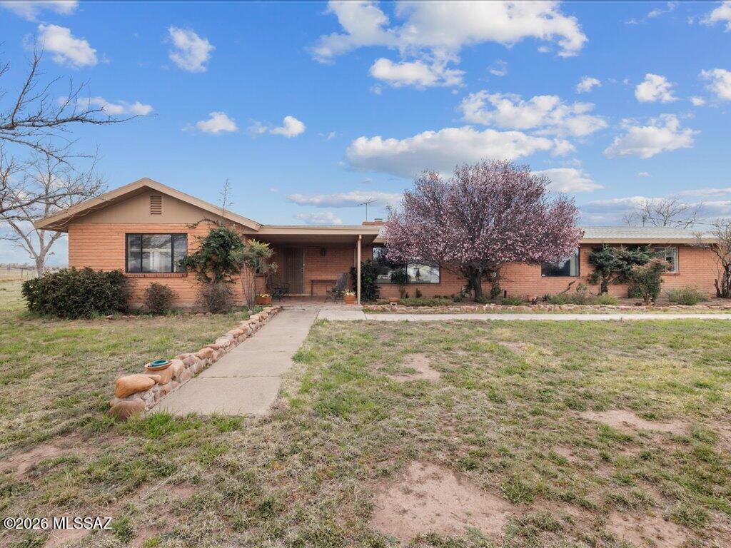 Enjoy space, views, and quiet country living. This sturdy block 3BD, 2BA open floor plan with a massive stone fireplace on 4+ AC sits at the end of a road in Sonoita, Az. The property borders Babacomari Ranch to the south, providing a beautiful backdrop of open grasslands and big Arizona skies. Sellers highly motivated to negotiate! Served by a good private well, the acreage has plenty of room for horses, farm animals, gardening, or an orchard. With usable land and a quiet setting, it could work well as a private family farm, winter getaway, or investment property. A solid opportunity in one of southern Arizona's most scenic rural areas with room to grow and enjoy the open space, fresh air, and starry night skies that make this part of Arizona so special. Come take a look, easy to show!