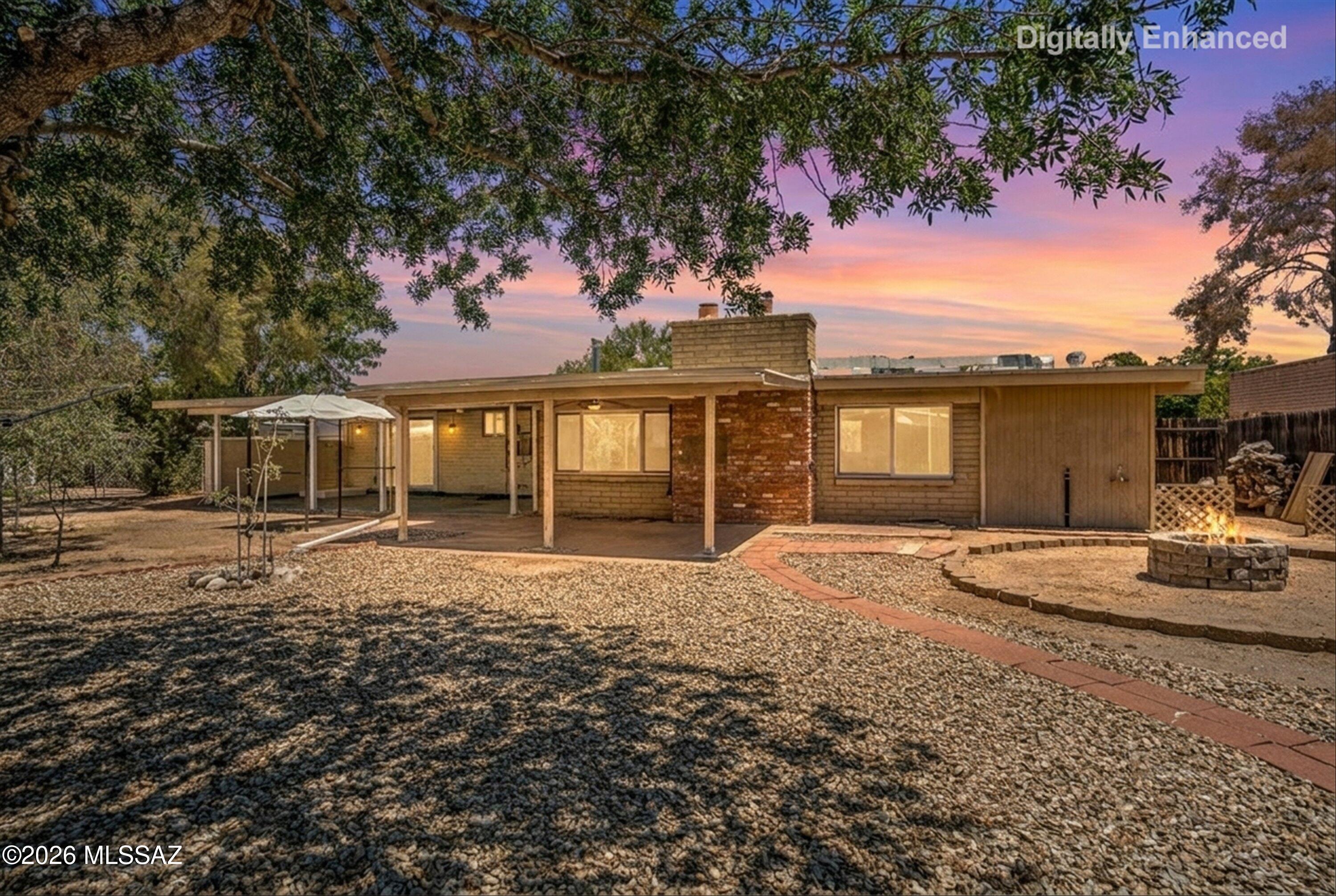 Replace ''location, location, location'' with ''location, space, and a large backyard!''  Discover the pride of home ownership in this well-maintained 5-bedroom, 3-full bath home in East Tucson, ideally located a short walk from Groves Park and Lincoln Regional Park.  Guest suite addition features a spacious bedroom with a private bathroom.  Additional bedrooms and space allow for flexibility, whether it is a home office, den, or just another bedroom.  Outdoor living shines in the large backyard, including patio and shed, and wood fencing along the side and alley.  Windows were replaced and dual-pane.  More than a 1970s brick charmer!