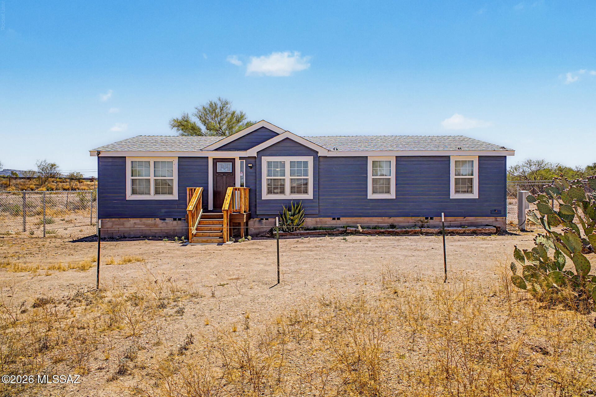 Fantastic opportunity to own this tastefully remodeled home on a huge 1-acre lot with horse privileges! PRICE RANGED FROM $254,000-$264,000. The inviting interior features tons of natural light, vaulted ceilings, neutral palette, and wood-look flooring t/out. Functional floor plan showcasing a large living room and a bright family room w/French doors to the back. The kitchen boasts SS appliances & ample wood cabinets. Main bedroom has a walk-in closet & a full bathroom w/dual sinks. Check out the backyard's fenced-in area, offering an elevated deck & a storage shed! Beyond the fence is an expansive area for horses, recreational use, or endless possibilities. Plenty of room for parking! Enjoy the mountain views! NEW HVAC, NEW kitchen, NEW bathroom, NEW everthing! Be the first to enjoy it!