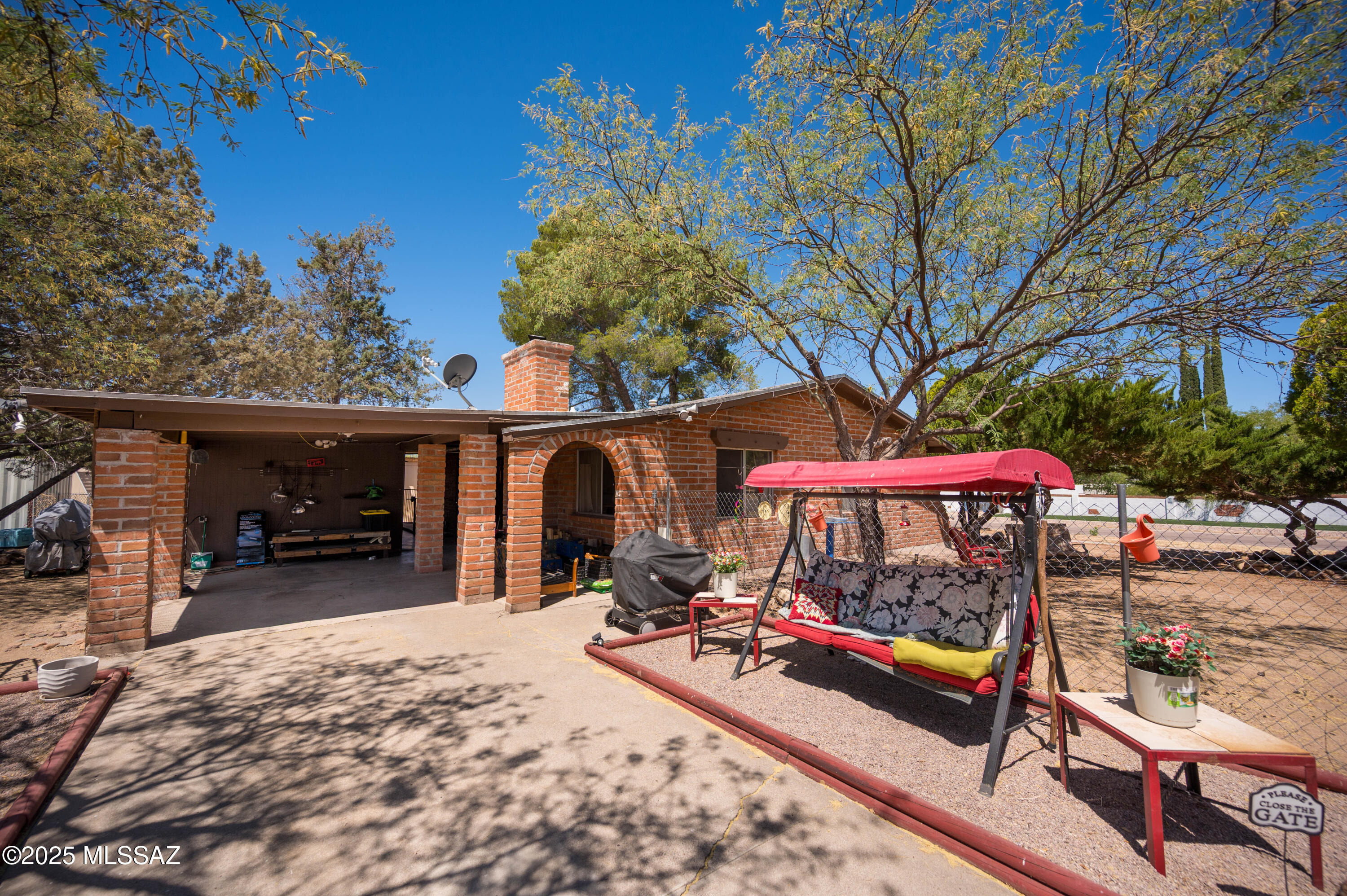 A really nice, well maintained home in the Village of Kino Springs !!  This cozy adobe home has an updated kitchen, updated bathroom, ceramic tile, beautiful mountain views, covered patio, fenced yard, new roof, mature landscaping, 4 storage sheds and plenty of room for RV parking !!  The adjacent two lots (parcel # 150-02-298 and #150-02-299) are included in the price (total acreage .64 acres) ..