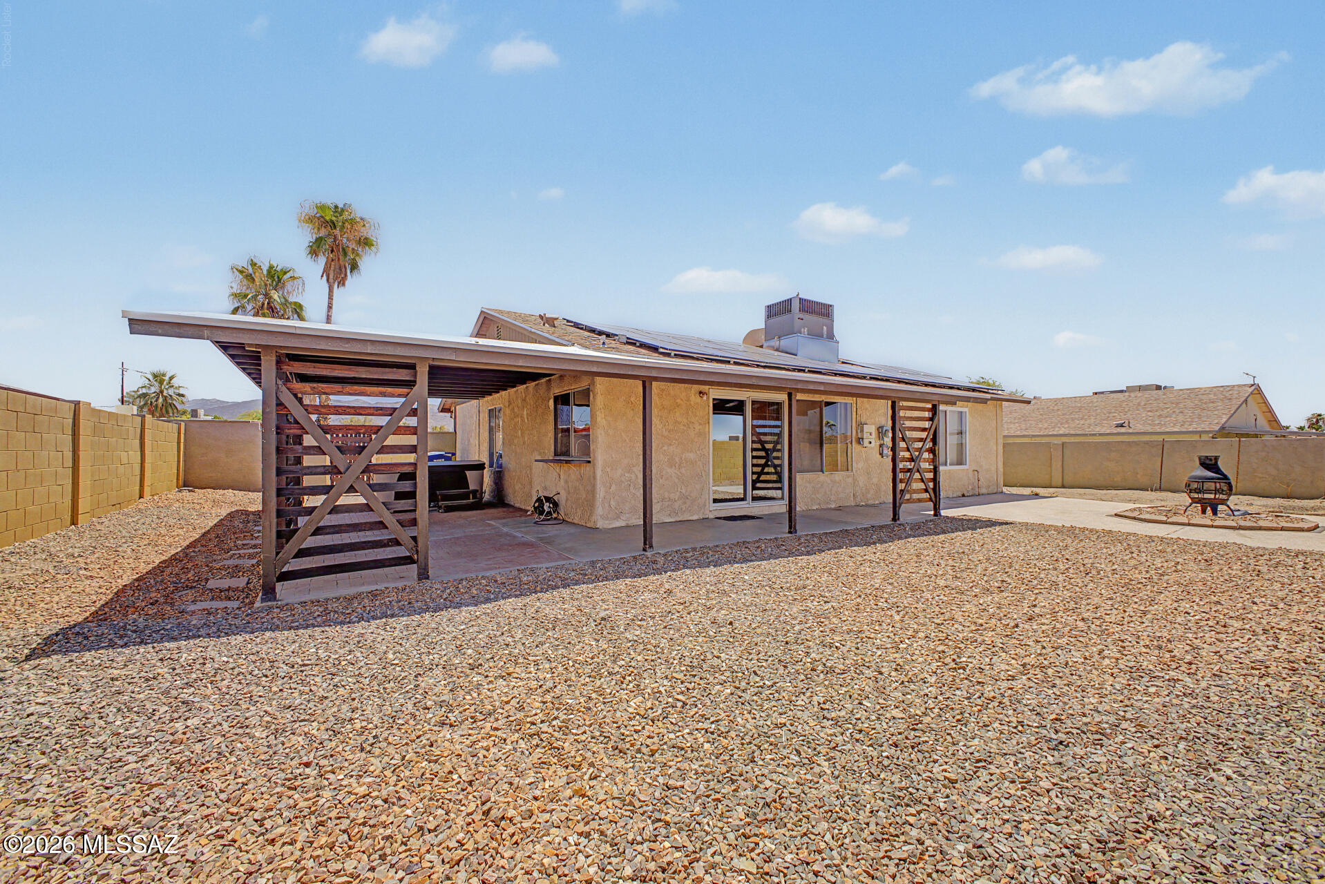 $29,000 PRICE REDUCTION! WORTH A 2ND LOOK! Come see this deal today! Fantastic East Tucson opportunity with 1,795 sq. ft., 3 bedrooms, 2 baths + 2 bonus rooms ideal for bedrooms, office, gym, crafts or hobbies. SOLAR PANELS WILL BE PAID OFF AT CLOSING, offering valuable potential savings on monthly electric bills. HVAC & spa are only 5 years old; roof is approximately 8 years old. Bright interior with natural light, designer palette, tile/carpet flooring, and an eat-in kitchen with espresso cabinetry, new stove & dishwasher, plus refrigerator, washer & dryer included. Spacious backyard with L-shaped covered patio, chiminea, mountain views, and beautiful sunrises/sunsets. Desert landscaping and RV parking space add convenience. Excellent location near Leman Academy, hospital, polic department & library.  DON'T JUST LOOK--COME SEE IT! Schedule your tour, walk the property, and BRING YOUR SERIOUS OFFER! SELLER IS MOTIVATED AND WILL CONSIDER ALL SERIOUS OFFERS! THIS JUST MIGHT BE WHAT YOU'VE BEEN LOOKING FOR!