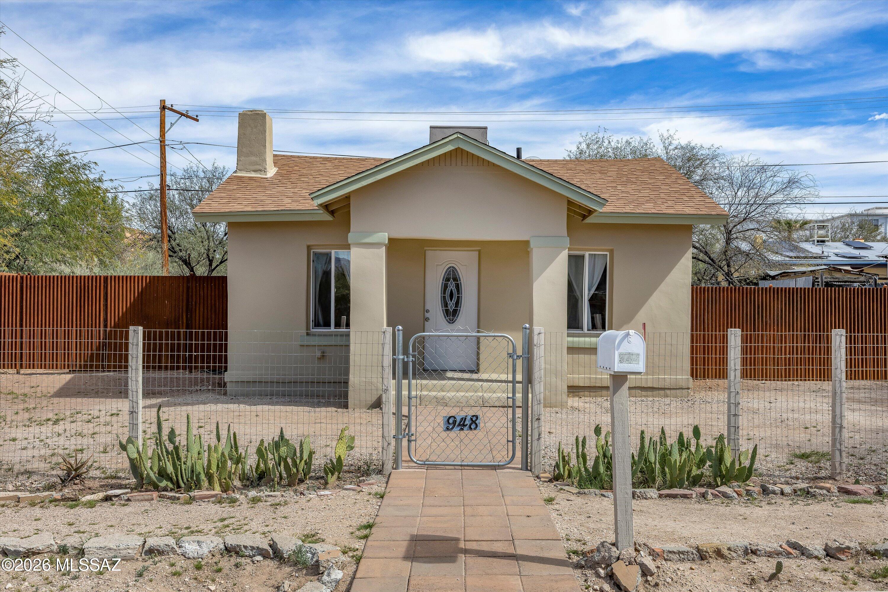 Located in the historic, diverse Dunbar Spring neighborhood, this adorable 600 sq ft, 2-bedroom, 1-bath bungalow is just minutes from downtown and the University of Arizona. Built in 1921 with framed masonry construction, this home blends historic charm with modern updates, including new exterior paint, a new roof, stainless steel appliances, newer water heater and a cozy ornamental fireplace.

Enjoy added flexibility from the large permitted storage shed with water, gas and electric-could be made into a workshop or studio.

Ideal for a professor, retirees, students, family or investor seeking a strong rental opportunity in a prime location close to everything.