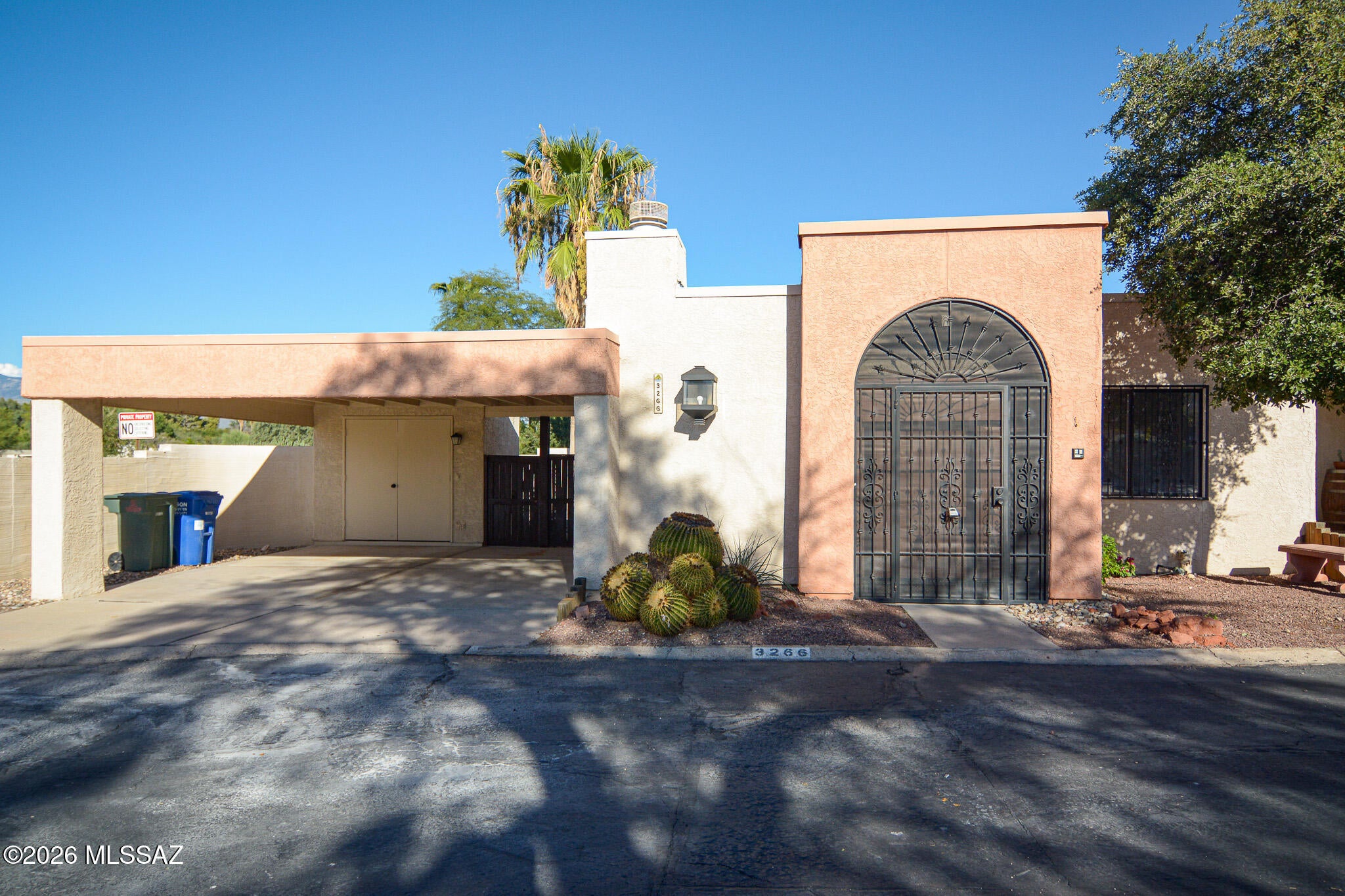 Beautifully remodeled Southwestern style townhouse. Located in a convenient Central Tucson location. Rich wood look LVP flooring. Updated modern kitchen. New Stainless steel appliances. New custom interior paint. New carpet and padding in bedrooms. Wood burning fireplace in living room.  Updated bathrooms. Ceiling fans in living room and bedrooms. Fenced yard. Mature trees. Upgraded door hardware and light fixtures. Two car carport. Mountain Views. This home shows beautifully.