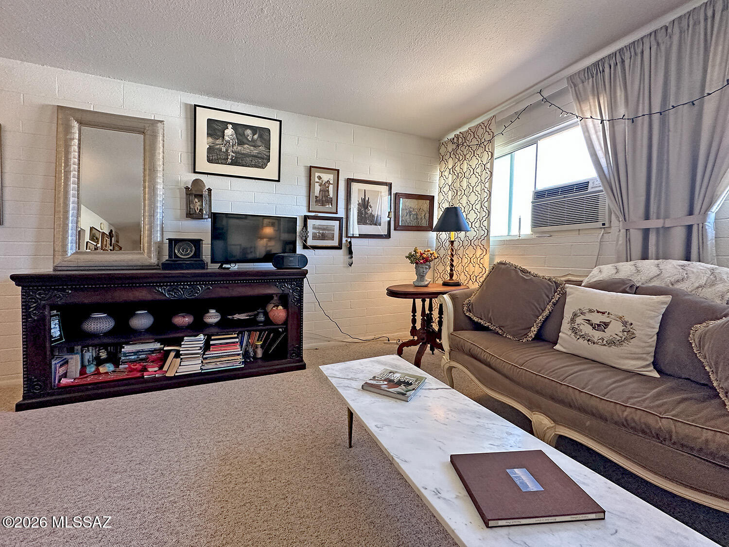 This charming 1-bedroom, 1-bath upstairs end-unit co-op in central Tucson offers privacy, views, and a penthouse-like feel. Move-in ready, the home features fresh paint, new carpet, stylish updated light fixtures, and all appliances are included. An A/C unit in the living room keeps the space comfortable year-round, making it the perfect place to relax and unwind. The monthly fee provides exceptional value, covering property taxes, water, sewer, trash, roof maintenance, pest control, grounds upkeep, pool access, and more.

Ideally located just a few blocks from shopping, restaurants, and public transportation, this home also offers easy access to Reid Park, where you'll find a golf course, walking paths, recreation facilities, a dog park, and beautiful green space. More... Downtown Tucson and the University of Arizona are only minutes away, making this an affordable and convenient place to call home. Cash purchase only. No rentals permitted.