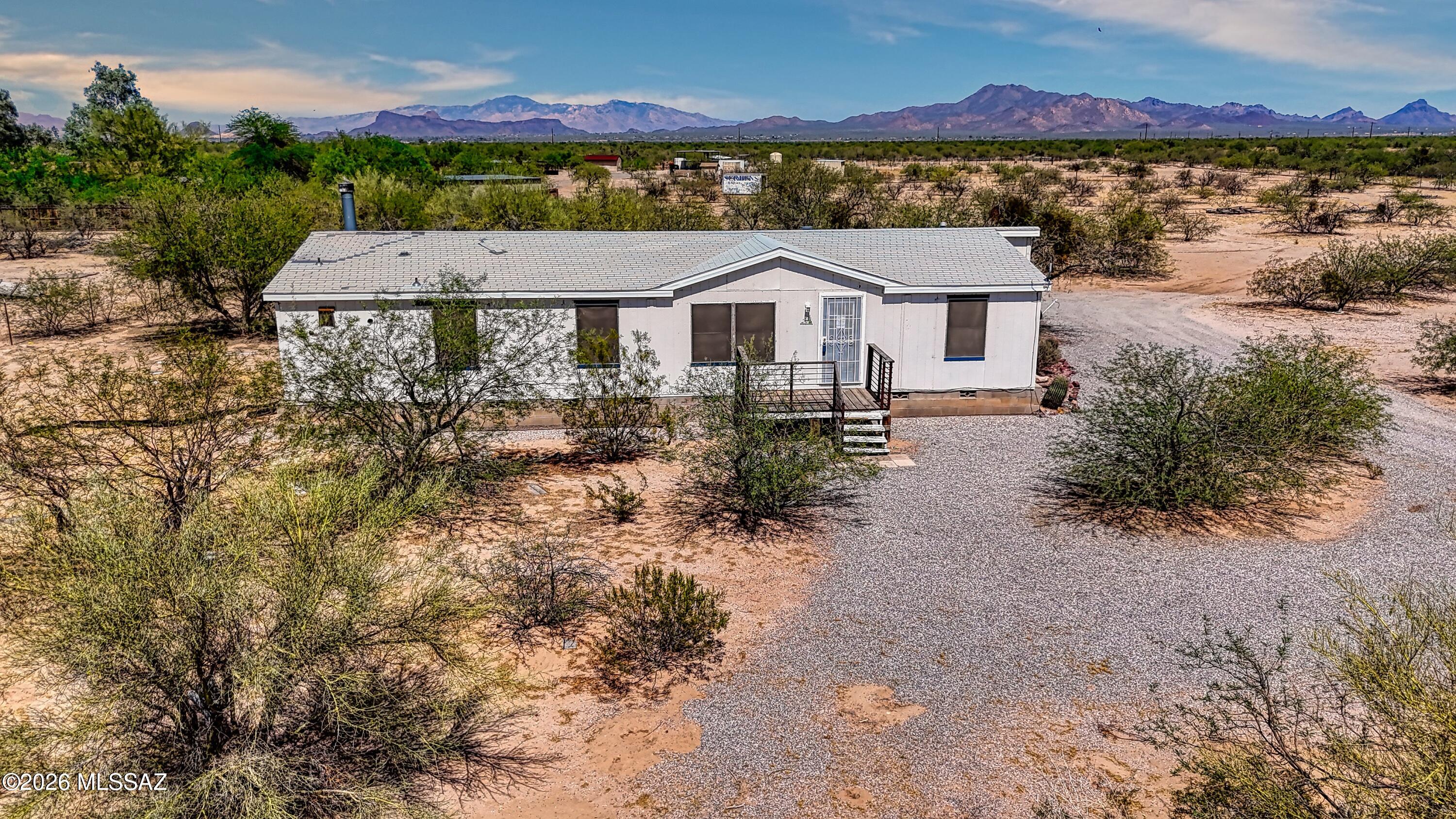 Discover 4410 N Parrot Lane in Marana, a 5 acre desert property with sweeping mountain views, wide open space, and endless potential. The 3 bedroom, 2 bathroom home offers a functional layout ready for customization. The property provides flexibility for horses, RV parking, equipment, or future improvements. This property offers incredible potential in a scenic rural setting.