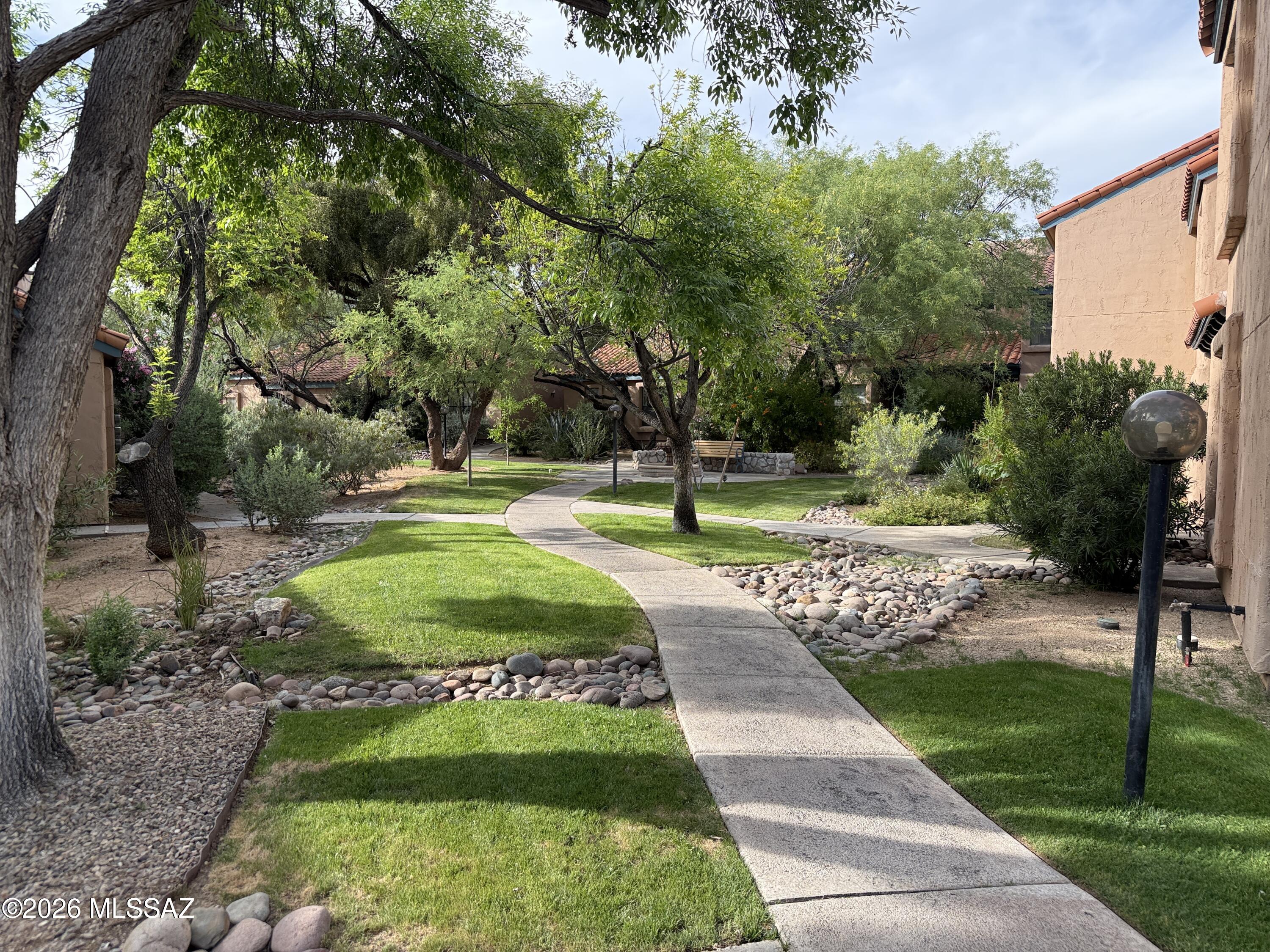 INCREDIBLLY CHARMING UNFURNISHED TOWNHOME. 2 Br 2 BA PLUS LOFT. 2 Bedroom and 2 Baths on main floor. Spiral Staircase to Loft and EXTRA sleeping area. Pool and Ramada just down the road and the Tennis Courts out your patio gate.  This Townhome is tucked a soft easy walkway just a few feet from your parking space.  Your view is of the inner courtyard and mountains for a peaceful private and cozy 6 month to 12-month Rental. Walk, ride or stroll this beautiful community at your own leisure. Close to Sabino Canyon Recreation Hiking, Biking or ride the Tram up if you want a change. Tenant pays Electric.  Water is included.  Community features 2Pools Hot Tub, Workout Fitness Center and Clubhouse, BBQ Grills, Tennis Courts. Absolutely perfect location. Come Home to comfort and convenience.