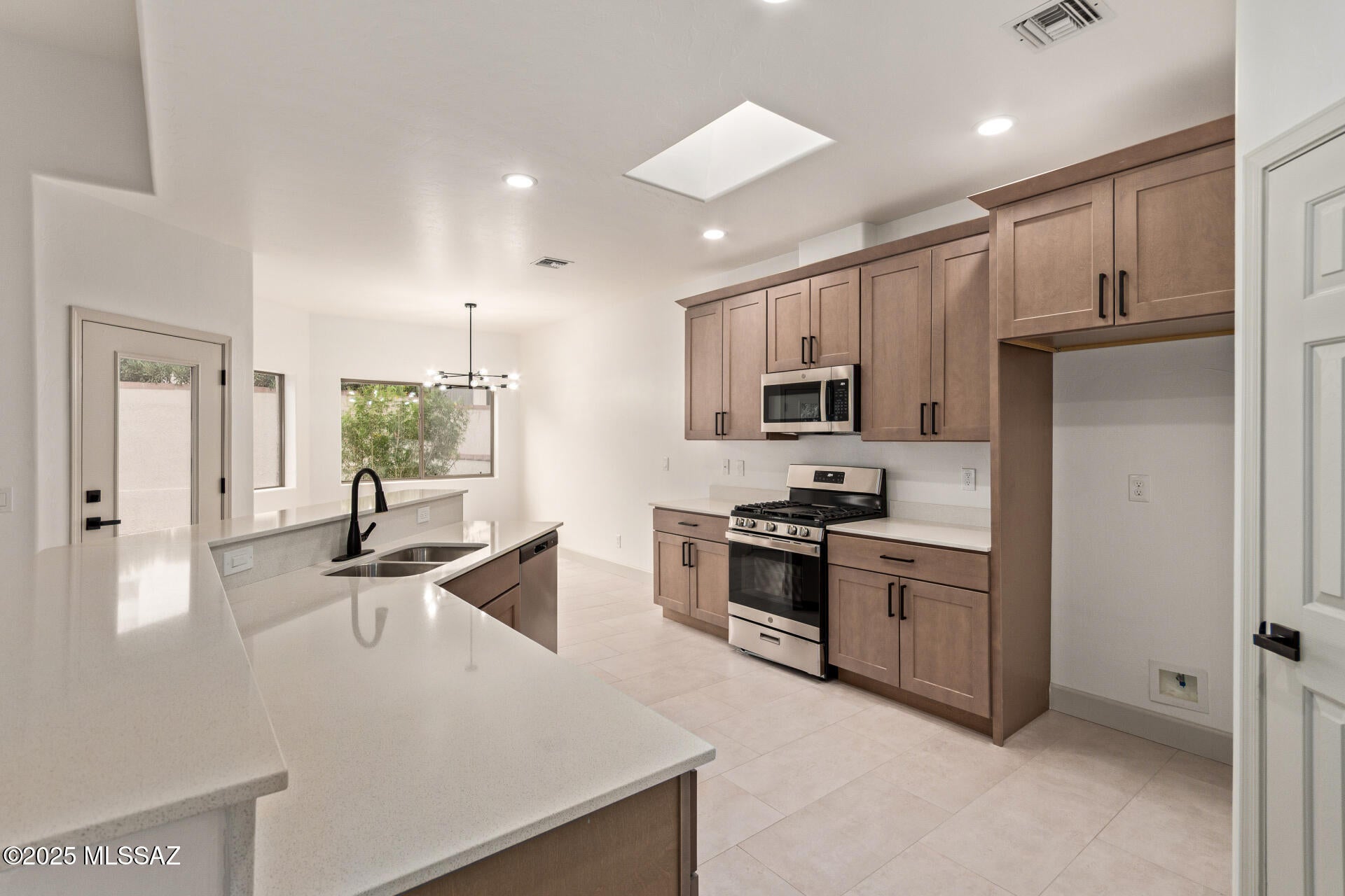 Tucked into the gated community of Canada Vista, this 2-bedroom plus den townhome delivers a low-maintenance lifestyle with a functional layout and quality finishes throughout. Desert landscaping and inviting curb appeal lead to a 2-car garage finished with epoxy flooring. Inside, an open, light-filled floor plan connects the main living areas, anchored by a well-appointed kitchen with shaker-style cabinetry, recessed lighting, sleek countertops, and stainless steel appliances. The primary suite is a true retreat, featuring a spacious walk-in closet and a spa-style ensuite with an oversized dual vanity and tiled shower. Step outside to a private, covered patio backyard with direct access to the golf course at El Conquistador Country Club. Owner/Agent.