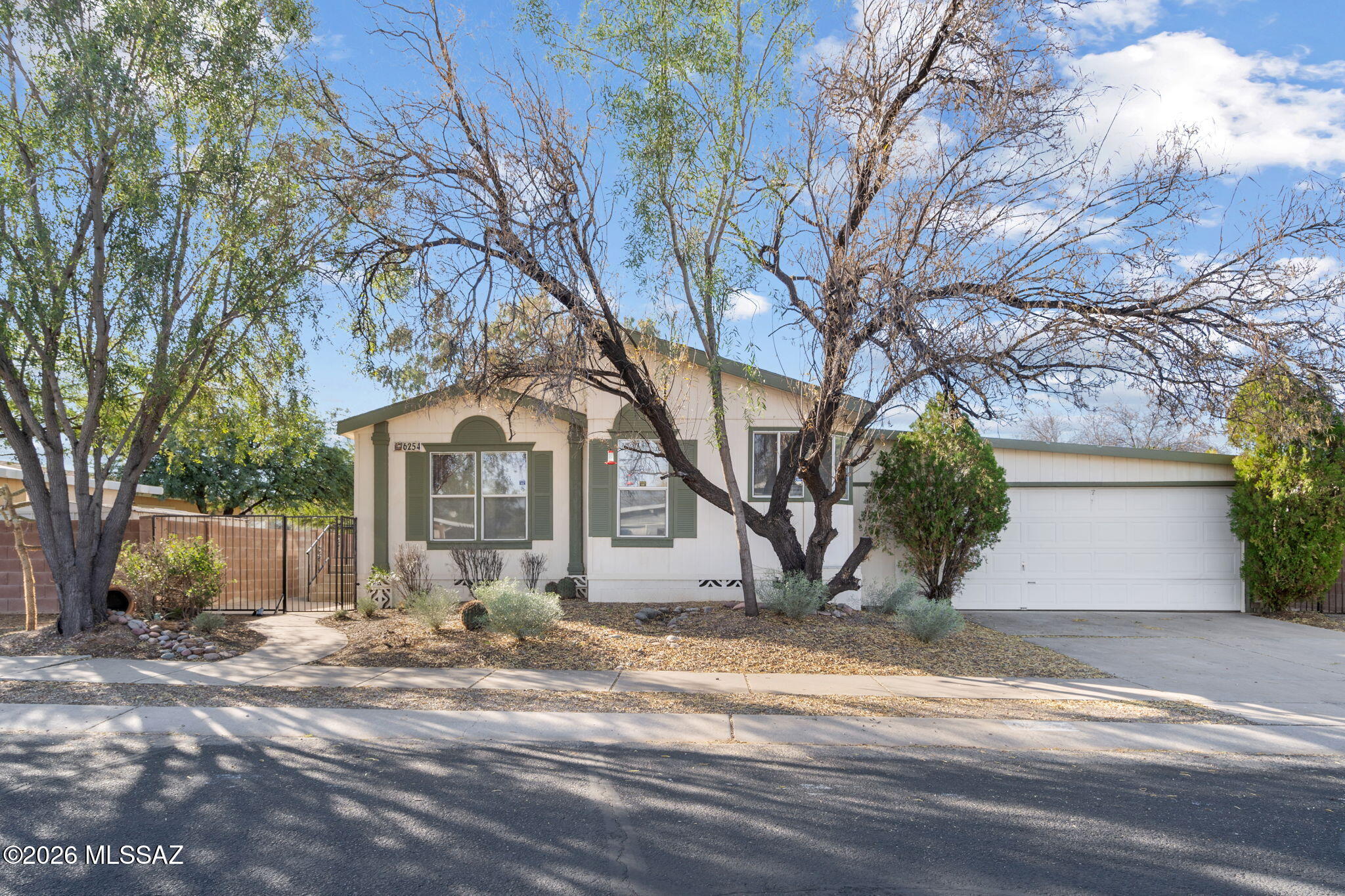 Discover the potential in this charming 3-bedroom, 2-bathroom manufactured home located in a serene and sought-after gated community. Offering peace of mind and privacy, this property is a clean slate ready for you to make it your own.
A standout feature is the covered carport, uniquely designed with a garage-style front door for great curb appeal while remaining open to the back for easy breezy access and ventilation. Practical updates have already been handled for you, including a brand-new HVAC system that comes complete with a transferable 5-year warranty, ensuring year-round comfort from day one.
Inside, the spacious layout invites you to reimagine the space. While well-loved, the home is ready for a style refresh— particularly the flooring, giving you the perfect excuse to install the luxury vinyl plank or carpet of your dreams immediately.
Please note: The current owners have never occupied the property, offering a straightforward sale. Whether you're an investor looking for a solid project or a homeowner ready to build equity by adding your own style, this home offers the perfect balance of "move-in ready" mechanics and "make-it-yours" cosmetic potential.