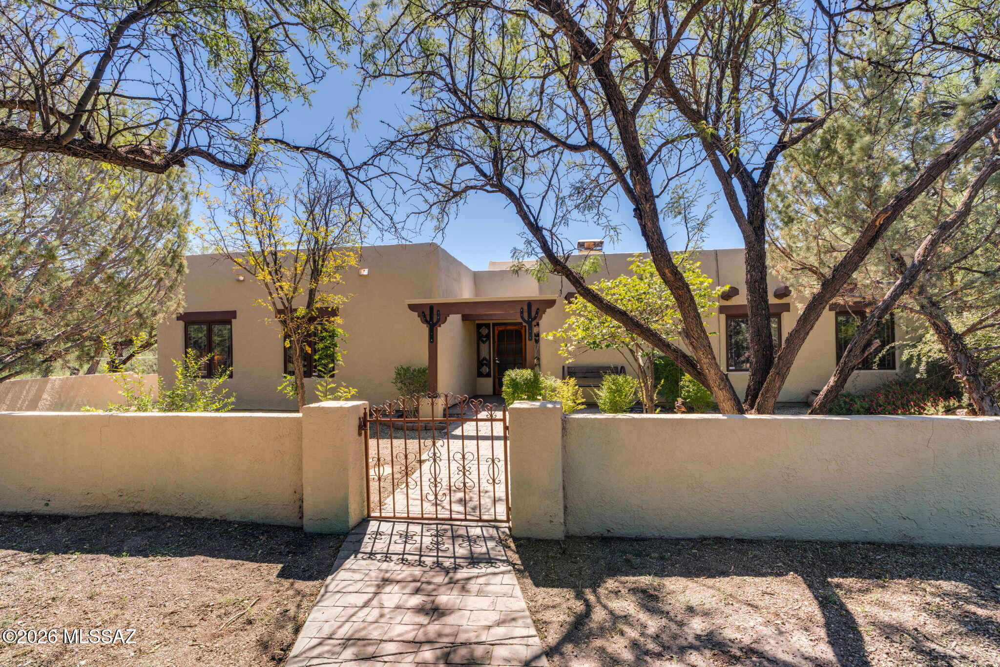 A truly extraordinary Southern Arizona ranchette - 20 private acres with the Babocomari River meandering through the property, with land extending to both sides of the river. Rich with natural beauty and character, this one-of-a-kind retreat offers exceptional privacy, sweeping views, abundant wildlife, and the kind of tranquility that is increasingly difficult to find. At the heart of the property is a custom home featuring 3 bedrooms and 2 bathrooms. Warm Saltillo and authentic Baja tile from Mexico complement soaring ceilings finished in 1.5-inch Georgia yellow pine tongue-and-groove. Hand-peeled Ponderosa pine, personally selected from the forests near Reserve, New Mexico, adds rustic character, while Pella windows with solar shades frame the surrounding landscape.

A spectacular woo A spectacular wood-burning fireplace with blower and integrated ductwork provides both ambiance and functional warmth throughout the home.

Designed to embrace the outdoors, the home opens to beautiful patios and intimate courtyards perfect for morning coffee, outdoor dining, or simply taking in the quiet. A custom steel-roof screened gazebo creates an idyllic place to watch birds and wildlife, and enjoy Arizona sunsets.

The property is exceptionally well suited for a ranchette, homestead, artist's retreat, workshop, or anyone craving room to create. Two substantial metal buildings provide tremendous flexibility: a 40'x20' garage and a 50'x30' workshop featuring a separate entrance plus an approximately 10'x18' black room and print shop area with mini-split systems. The configuration offers exciting possibilities for studio, workshop, hobby, storage, or potential conversion of a portion of the building to an additional living suite.

A 40'x30' greenhouse with a separately fenced garden area offers wonderful potential for organic gardening and year-round growing. A private well, well house, and cross-fencing along portions of the property add to the functionality of this remarkable acreage.

Despite its peaceful, private setting, the property remains remarkably accessible - approximately 18 minutes to the Sonoita/Elgin wine country, 20 minutes to Tombstone, 25 minutes to Sierra Vista or Benson, 45 minutes to Bisbee, and about 70 minutes to Tucson International Airport.

This isn't simply a home in the country...it's a rare opportunity to own a remarkable piece of Southern Arizona.