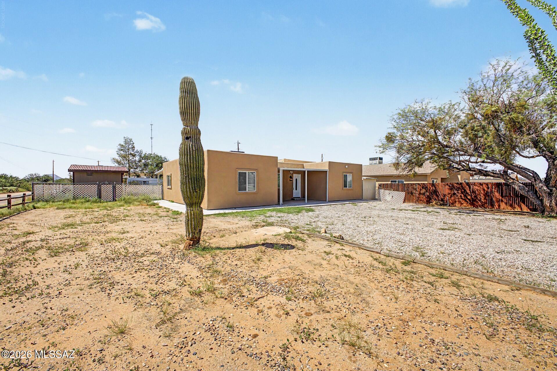 Outdoor enthusiasts, This home has been totally refurbished, offering clean, refreshed space and comfortable Sonoran Desert living. Step inside to discover a refreshed, light-filled layout featuring new flooring, fresh interior and exterior paint, and clean trim throughout. The open living area seamlessly flows into a spacious, light-filled layout with central refrigeration cooling to keep the home comfortable year-round. Both bathrooms have been fully overhauled with updated fixtures and clean finishes. with open land right next door, you have easy access for riding toys, side-by-sides, dirt bikes, or heading out on endless off-roading adventures under the open Arizona sky. The lot itself offers plenty of room for trailer, vehicle, or RV parking.