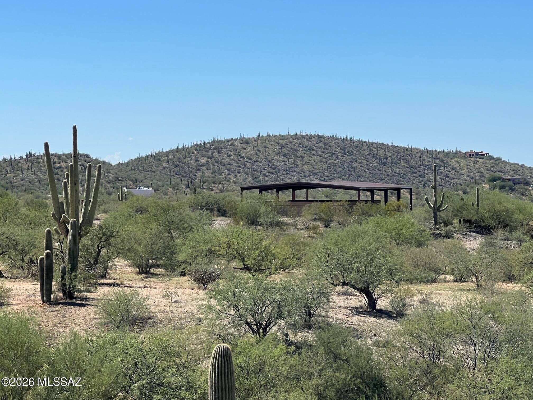 Sugarfoot Ranch - Vail, AZ - 10 acres set in the scenic Sonoran Desert at the base of the Rincon Mountains. Custom 3 bedroom Santa Fe home, built 2019. Great room, beautiful kitchen , 2 luxurious baths, large Laundry, W&D incl. Custom doors, cabinets, floating vanities, quartz counters, and stained concrete flooring. Pella windows, Solatubes. H/W Heater 2025, Water softener 2024. 

Private well. Detached steel canopy over home preserves roof and provides shade over patios. Shed, hay shelter. Tack Rm - workbench, washer/dryer. Corral, 2 pens, birthing stall, 3 shade shelters. Field, steel, and solar electric fencing. RV space. 

Close to hiking, biking, & riding trails, AZ Trail, Saguaro National Park, Colossal Cave nearby. Top rated Vail Schools.