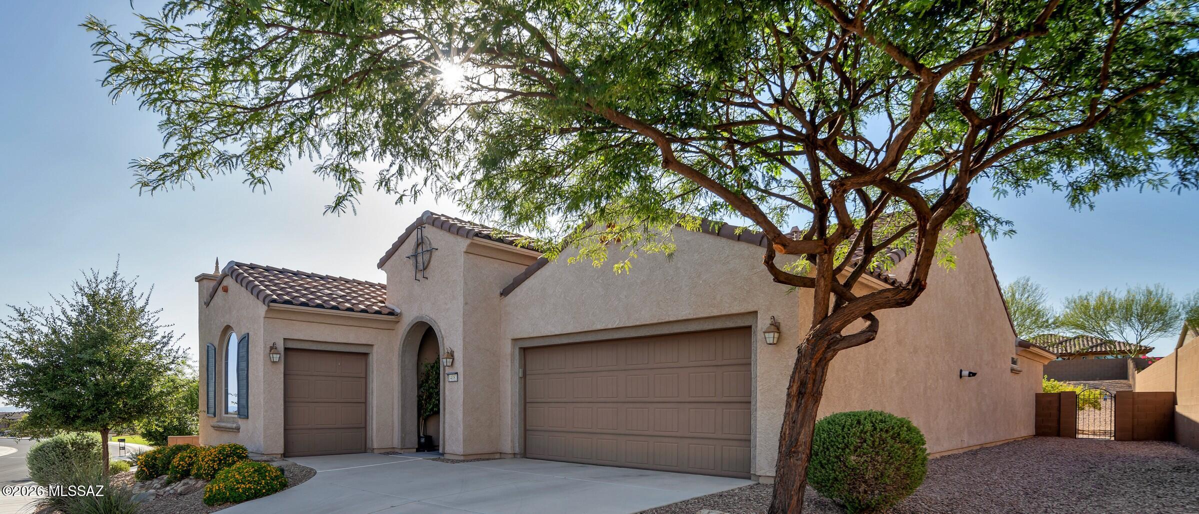 Welcome to Del Webb at Dove Mountain/Marana, AZ, living as it was designed to be enjoyed. This spacious PRESERVE model Spanish styled home features a great room, an expansive den/office/media room with custom French-glass doors, tray ceilings in den, foyer & bay window owner's suite, 2 bedrooms & 2 full baths, raised dishwasher, granite counters, new garbage disposal, stainless luxury gas range, tankless on demand hot water, newer water softener, 2 car & storage area garage & golf cart garage, 2 patio areas face north, Tortolita Mtn Peak Views, all of this sits on a 1/4 acre lot with artificial turn putting green. Lots of storage space, beautiful tile & carpet, gas stub for BBQ & closely located to the Saguaro Center at D Webb Mtn. This home is a must see; must buy. This is the one. HOME.