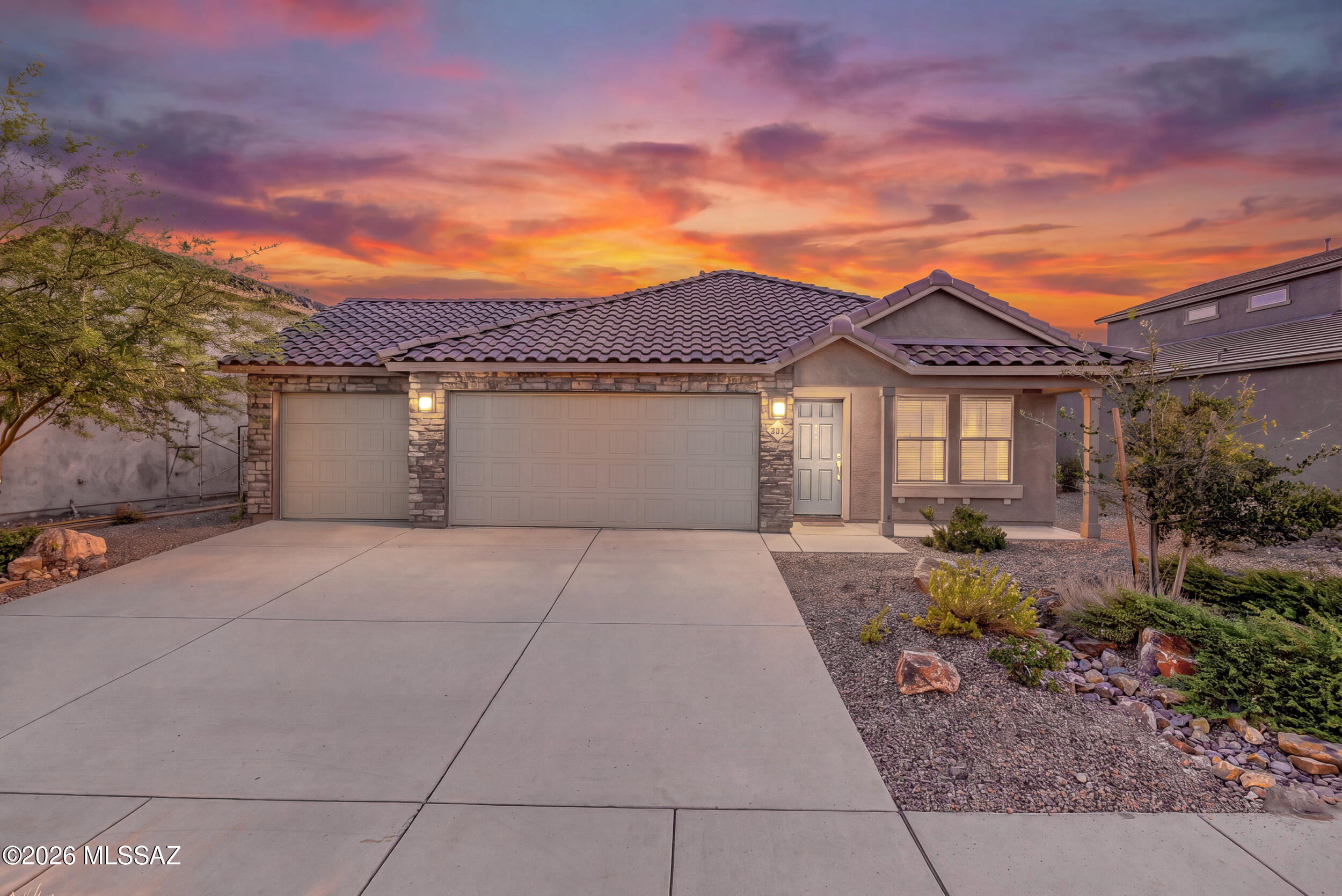 Former Lennar model home with a 3 car garage in Rocking K Ranch, Vail, AZ. This 3 bedroom, 2 bath home has 1,427 square feet and Rincon Mountain views from the backyard. The open layout connects the kitchen, dining area, and living room. Upgrades from its model home days include tile accent walls and updated fixtures. Rocking K Ranch is a master planned community in the Vail School District on the southeast side of Tucson. Neighbors gather at the community park, where you'll find pickleball courts, basketball courts, playgrounds, and grassy fields for a game of catch or an afternoon picnic. When you want to explore farther, local hiking and biking trails are just a short drive away. Come see what life in Rocking K Ranch looks like!