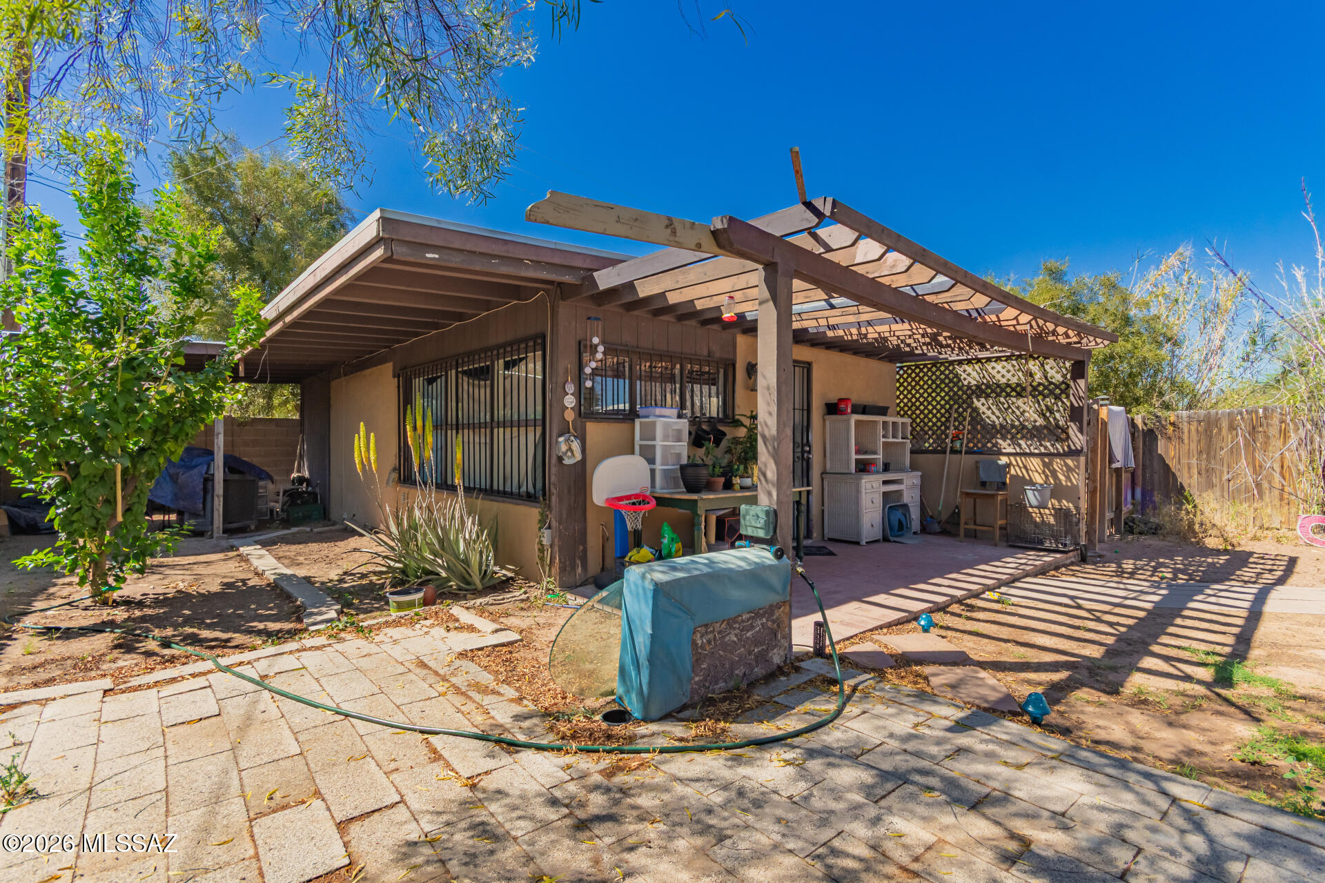 Rare opportunity to own two homes on one parcel! You'll love the combined living space of under 1,100 sq ft perfect for investors, multi-generational living, or rental income potential. Each unit offers a 1-bedroom, 1-bathroom layout and enjoys its own private yard, providing separation and flexibility. Both residences showcase charming beamed ceilings throughout and an equipped kitchen with cabinetry and matching appliances for a cohesive and functional design. One unit features a cozy fireplace in the living room, creating an inviting space to relax! Great location near public transit and shopping.  Enjoy versatility and unique value in a compact footprint. Make it yours! Do not bother tenants. Owner/Agent