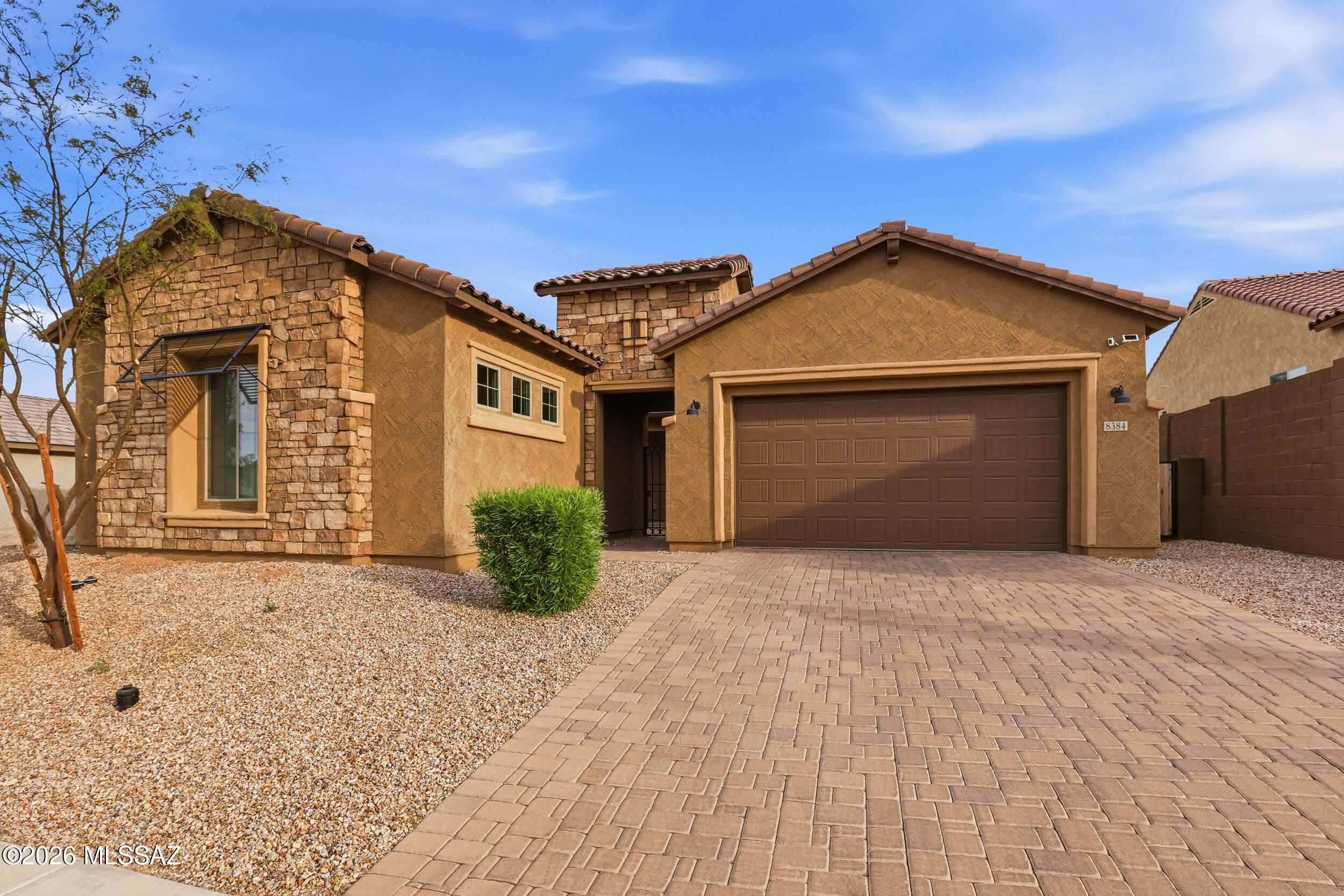 Welcome to this stunning Patagonia floor plan in Lazy K Ranch, Tucson, AZ, where refined desert living meets comfort, space, and breathtaking mountain views. Offering 3,485 square feet, this thoughtfully designed single-story home provides a seamless blend of open-concept living areas and private retreats. At the heart of the home is an expansive gathering room that flows effortlessly into the gourmet kitchen and café dining area, creating an ideal setting for both everyday living and upscale entertaining. Large windows invite in abundant natural light while framing stunning mountain vistas, while direct access to the covered patio enhances the indoor-outdoor lifestyle synonymous with luxury living in the Southwest. The owner's suite is privately situated and designed as a true retreat, featuring a spacious bedroom and a generous walk-in closet. Secondary bedrooms are thoughtfully positioned to provide comfort and privacy for family members or guests. One of the standout features of this plan is its versatility, offering options such as additional bedrooms, a guest suite, a private den, or a bonus room--allowing homeowners to tailor the space to fit their lifestyle, including multigenerational living or work-from-home needs. Additional highlights include high ceilings, refined architectural details, and a spacious covered patio ideal for enjoying Arizona's breathtaking sunsets and serene mountain surroundings. Altogether, this home embodies luxury living with modern design, exceptional comfort, and scenic desert beauty.