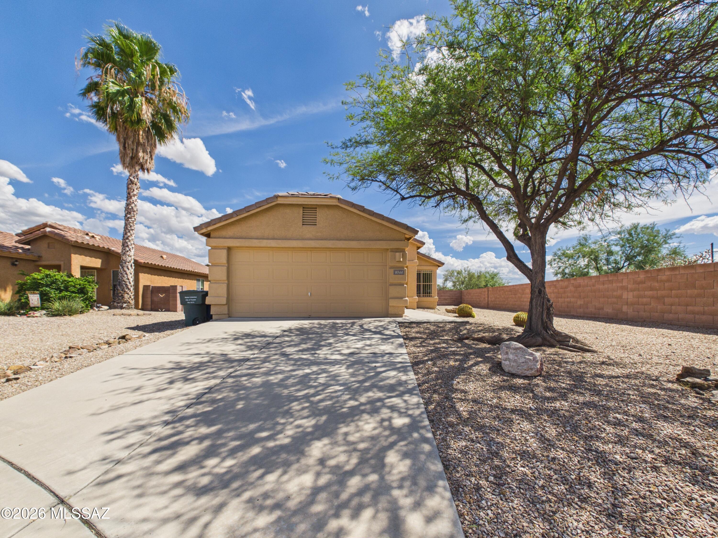Welcome to this inviting 3-bedroom, 2-bath home in the Pantano Edge community. This 1,258 sq ft home offers an open and functional floor plan with comfortable living spaces, a well-appointed kitchen with ample cabinetry and appliances, and a spacious primary suite with a private bath and generous closet space. Situated on a desirable corner lot, the property features a spacious backyard with block fencing and a covered patio, providing plenty of room for outdoor dining, relaxing, or entertaining. An extended car pad offers additional parking, while the attached 2-car garage provides convenient parking and storage. Enjoy nearby mountain views, parks, jogging and biking paths, shopping, dining, and easy access to S Camino Seco, E Golf Links Rd, and I-10.