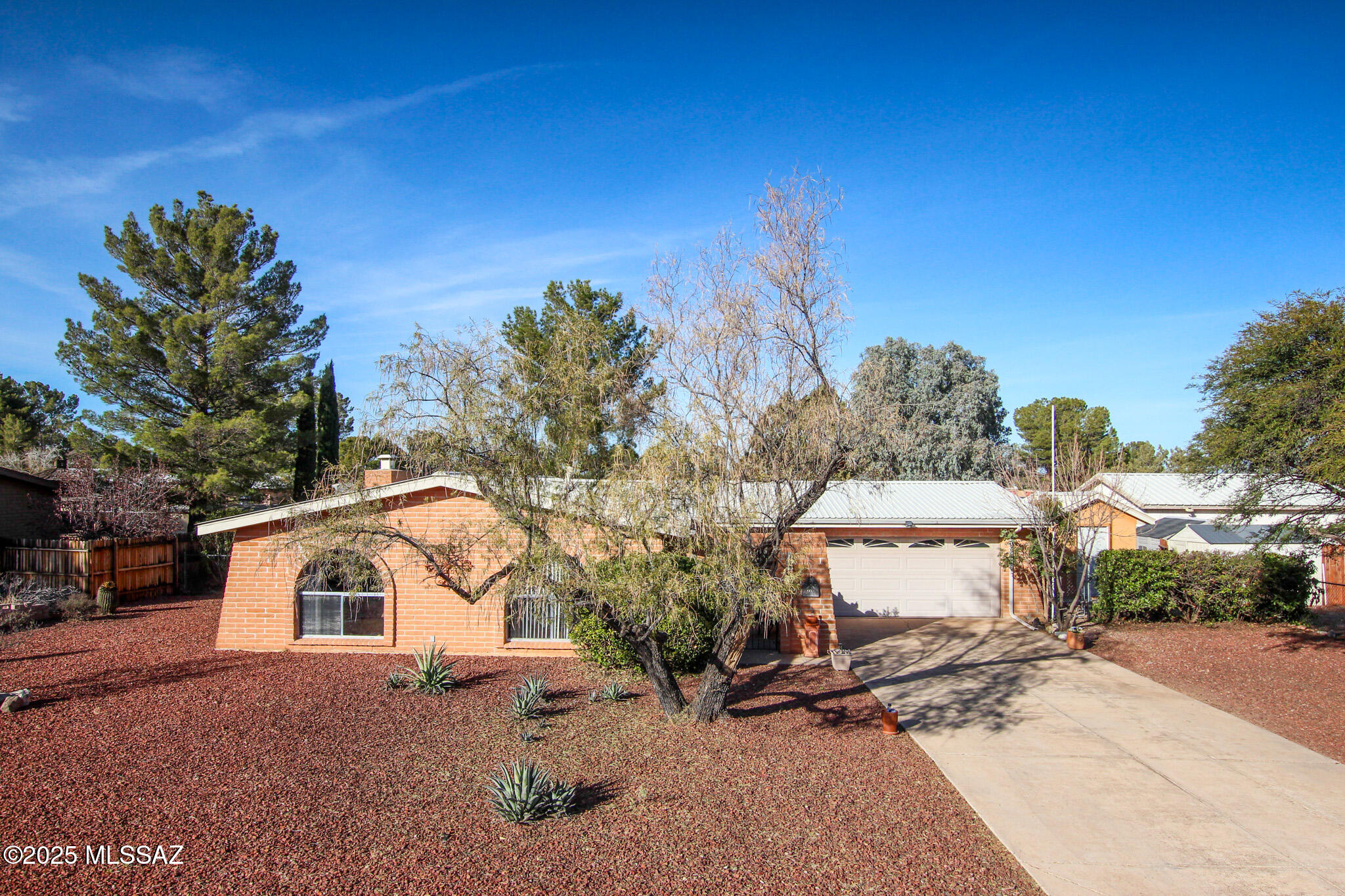 This charming 2BR/2Ba home offers comfortable living with a unique layout and a 2-car garage. Selling with furniture and appliances, it's truly move-in ready. Enjoy the custom Arizona room, perfect for relaxing or entertaining. A welcoming front courtyard adds curb appeal, while the spacious backyard with a shed provides ample space to unwind or customize to your lifestyle.