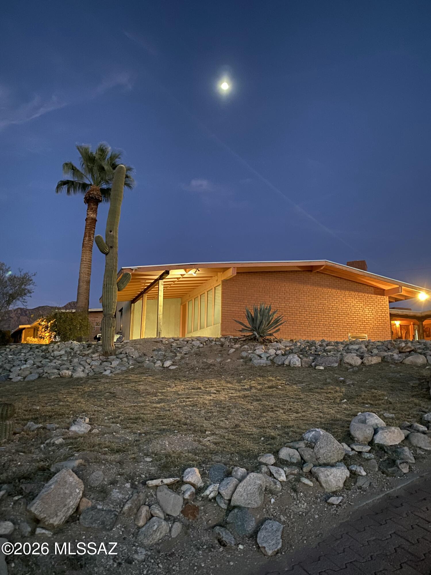 *Please download and read home Inspection summary * 
Large ranch home with sunset views in quiet neighborhood near shopping and restaurants - Formal living room - Kitchen has banquette seating with large window overlooking backyard and pool, quartz counters, leaded-glass front cabinets, soft close drawers all next to formal dining room. Huge primary with fireplace, vaulted ceilings, walk-in and cedar closet, large desk/counter under wall of windows. Second primary with sitting room and outside entry. Large family room with built-in bookcases and powder room. Other bedrooms are being used as an office, library and craft room. Large covered patio and side yard near pool, 2 car garage with workshop. Solar/electric hot water120 gallon tank, newer A/C units. No for sale sign on property