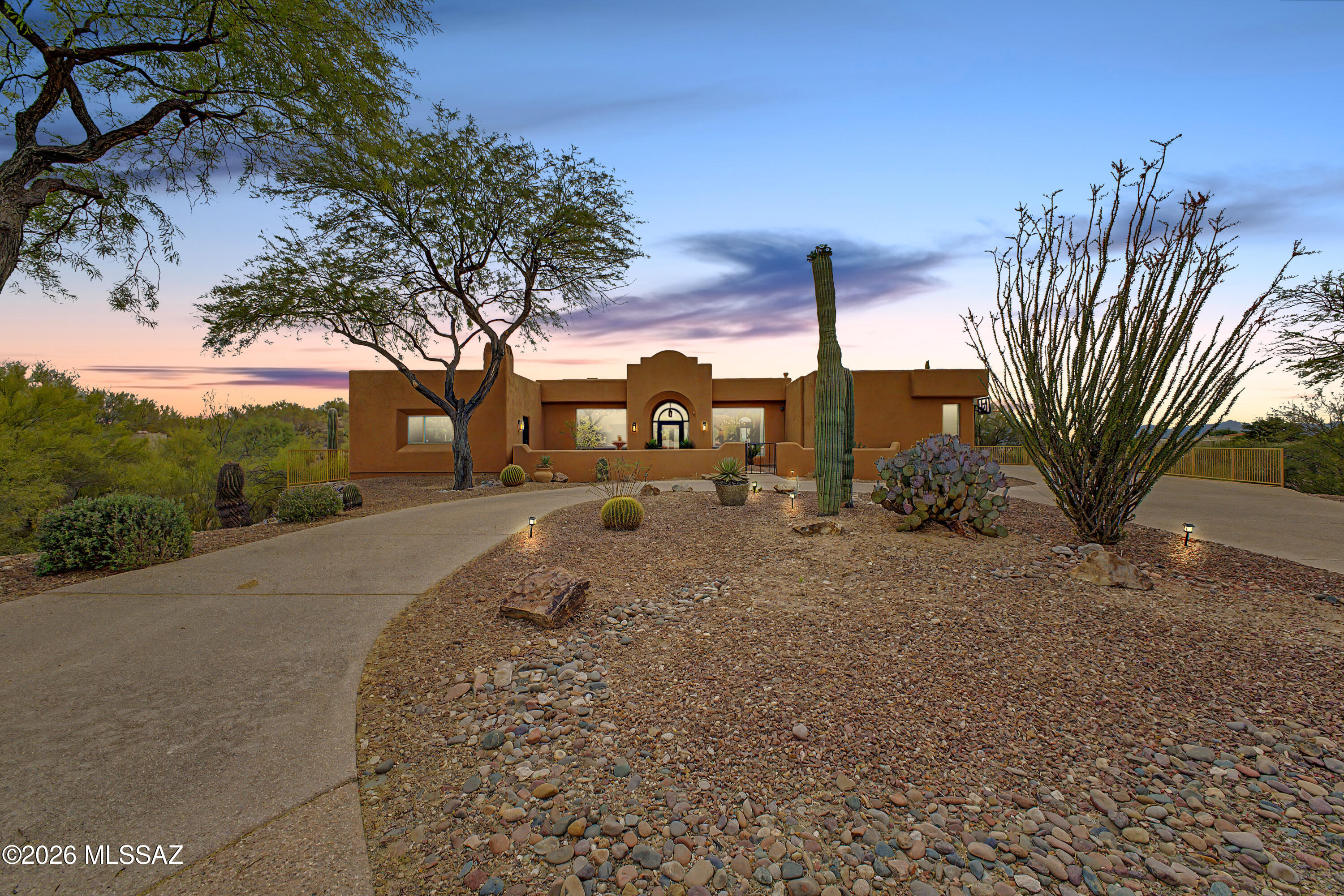 Experience the pinnacle of luxury in the exclusive gated enclave of Bella Catalina Foothills  with Panoramic City and Mountain Views. . This masterfully renovated residence is perfectly situated between dual desert washes, ensuring ultimate privacy for its breathtaking views. The heart of the home is a designer chef's kitchen featuring new quartz countertops, custom cabinetry with over/under-mount lighting, new appliances, a dedicated coffee/wine bar. The seamless indoor-outdoor flow leads to a resort-style backyard boasting a zero-edge pool, built-in fire pit, barbecue grill, sprawling primary suite with an exterior door leading to the back oasis, a large executive office/bedroom, built-in bookshelves with courtyard access and a tranquil water feature. Split floor plan, four bedrooms, three bathrooms, (one with pool access), a three-car garage with extensive storage. From the fresh flooring, paint, and designer lighting to the dual interior fireplaces and soft water system, every detail has been thoughtfully refined. Listing agent is related to the seller. 

Tour this beautiful home today!