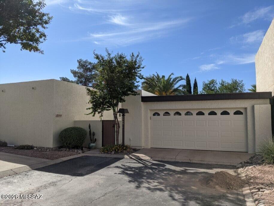 Charmin, remodeled 2 bedroom, 2 bath single-story townhome with tiled floorplan, vaulted ceilings and cozy beehive fireplace. Remodeled with modern touches including HVAC, ceiling fans, walk-in closets, and a functional kitchen with appliances. Washer and dryer included.