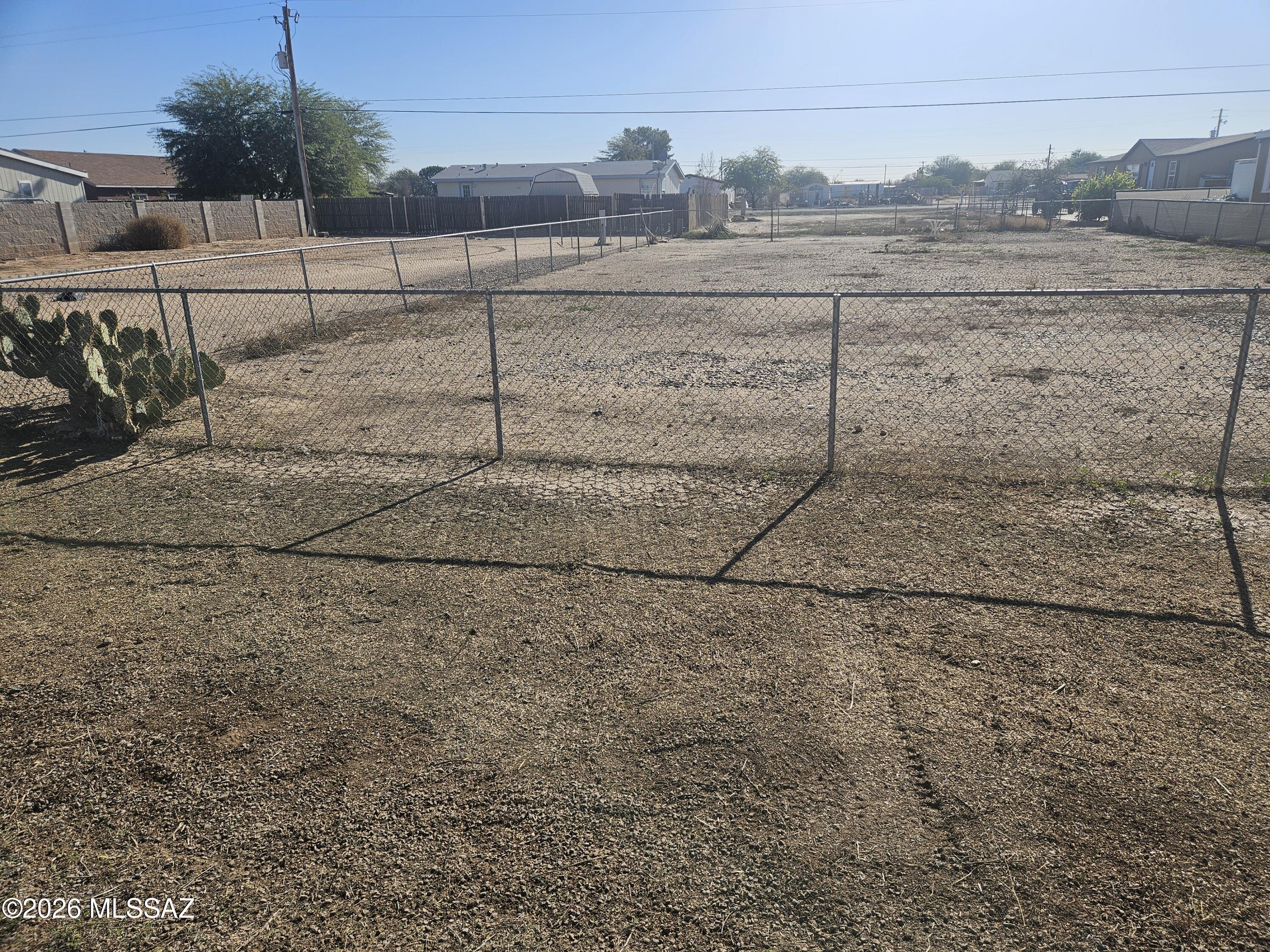 The lot is fully fenced with an access gate utilities are at the lot line property

Seller Financing Available (Owner Carry!)  $5,000 down owner will carry for 10 years P&I payment $263.62 Month 
Perfect to build your home in a growing neighborhood in Eloy Arizona. This is a perfect lot for your manufactured home. There are paved roads, water and power near parcel in this growing area. Situated apx. 1 hr. Southeast from Phoenix AZ, 1 hr. Northwest of Tucson AZ. Surrounded by wide open spaces for endless outdoor activities such as playing golf at one of the area courses, hiking and biking. This quiet rural setting is close to many amenities.

This is a great opportunity for someone