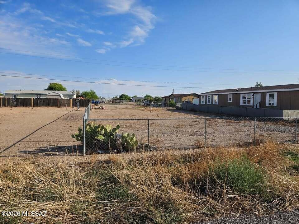 The lot is fully fenced with an access gate utilities are at the lot line property

Seller Financing Available (Owner Carry!)  $5,000 down owner will carry for 10 years P&I payment $263.62 Month 
Perfect to build your home in a growing neighborhood in Eloy Arizona. This is a perfect lot for your manufactured home. There are paved roads, water and power near parcel in this growing area. Situated apx. 1 hr. Southeast from Phoenix AZ, 1 hr. Northwest of Tucson AZ. Surrounded by wide open spaces for endless outdoor activities such as playing golf at one of the area courses, hiking and biking. This quiet rural setting is close to many amenities.

This is a great opportunity for someone