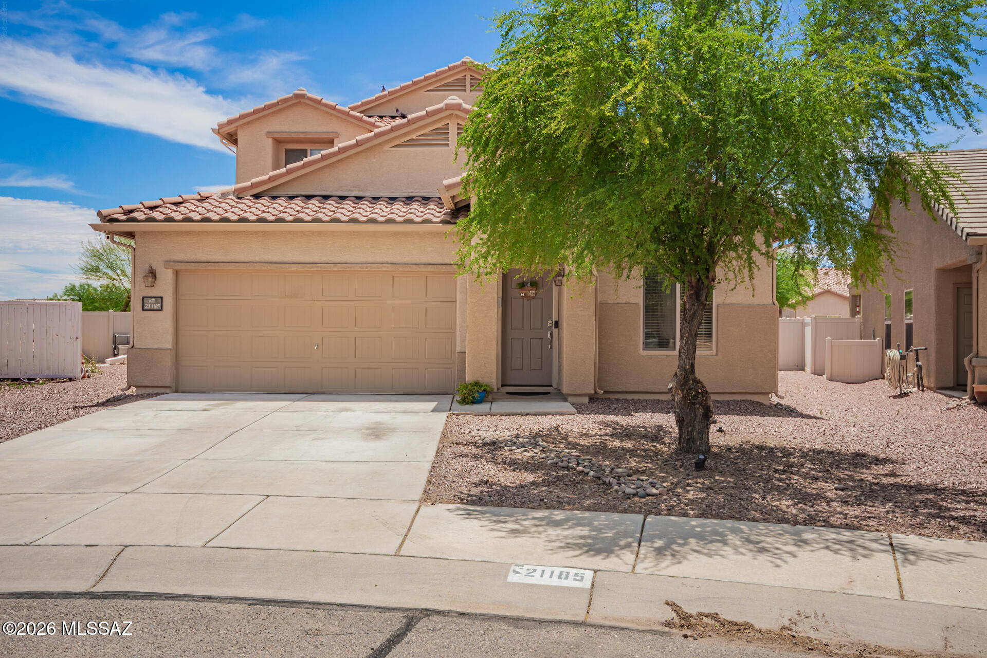 Welcome to your next chapter in vibrant Red Rock Village! This beautiful residence features a spacious two-car garage and easy-care landscaping! Step inside to discover an inviting open-concept living/dining space, seamlessly connected to the backyard through sliding glass doors. The kitchen boasts granite countertops, white cabinetry, stainless steel appliances, and recessed lighting. The primary suite is located on the main level and has a private bath with dual vanities and a walk-in closet. The versatile den is ideal for an office, while the upstairs loft offers the perfect space for a family room. The expansive backyard offers a covered patio, a built-in BBQ under the functional pergola, and abundant space for entertaining. Experience style and comfort in this amazing home!