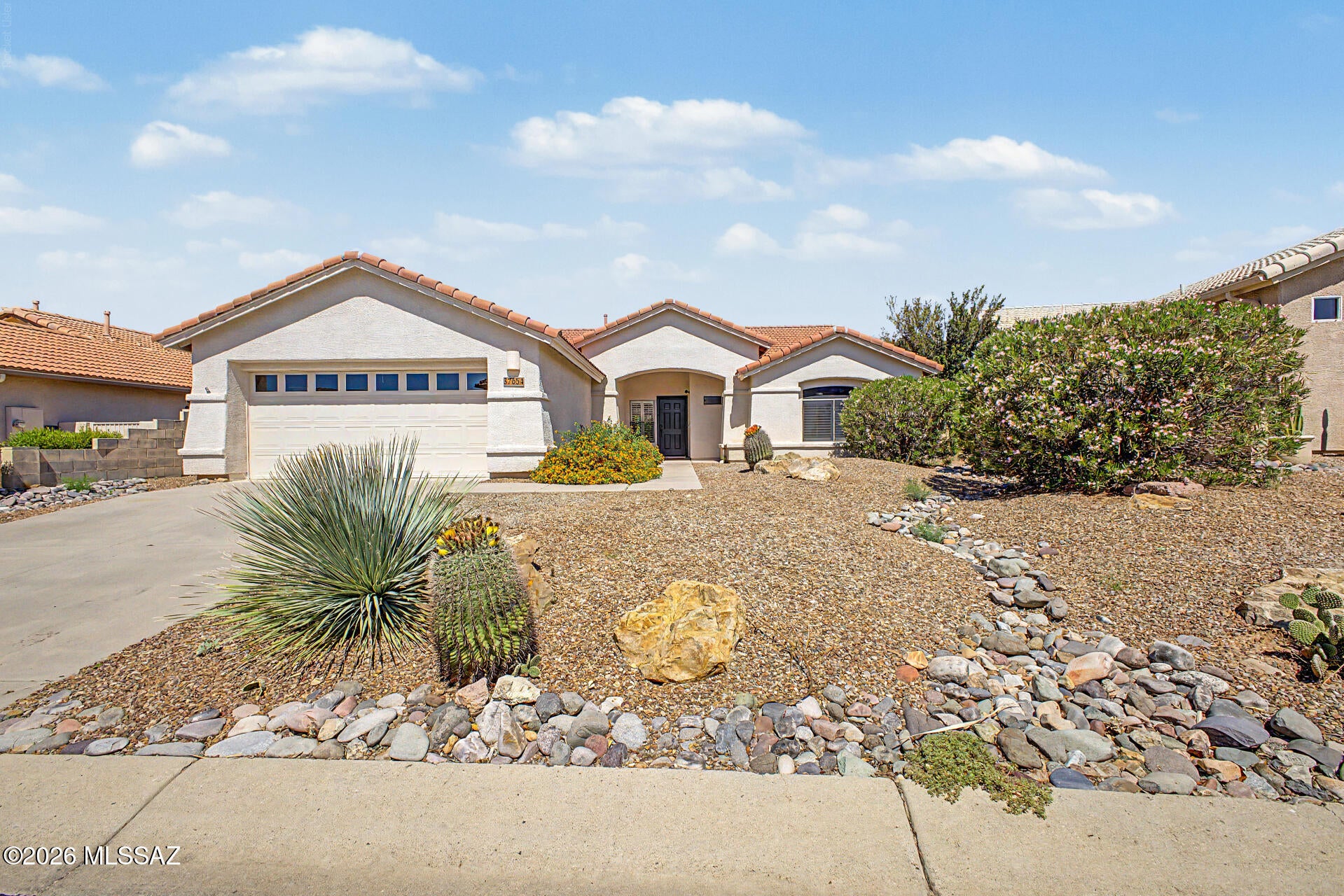 The search is finally over! Inside, you'll find a serene open layout with soaring vaulted ceilings, a soothing palette, classic plantation shutters, and durable tile flooring for easy maintenance. The gourmet kitchen features quartz counters, ample cabinetry, recessed lighting, stainless steel appliances, a practical pantry, and an island with a breakfast bar for casual dining. The tranquil primary bedroom showcases soft carpeting, an ensuite with double sinks, and a convenient walk-in closet for an organized wardrobe. Enjoy quiet afternoons in the backyard, which offers a spacious patio for dining al fresco and abundant space for outdoor relaxation. Hot Water Heater repl in 2021, A/C in 2017. Don't miss out on this gem!