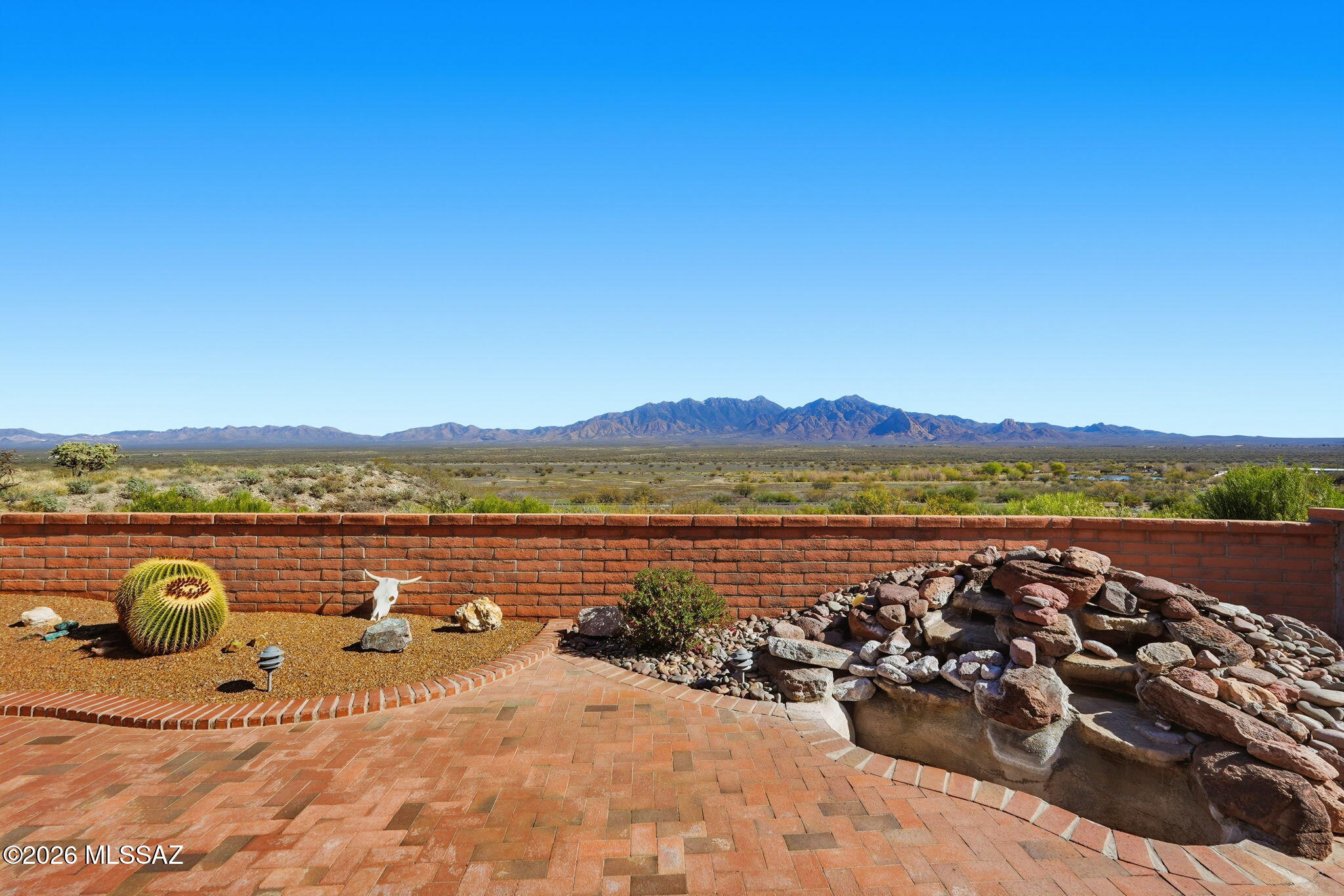 If you are searching for a move-in-ready home showcasing some of the best mountain views in town, this is it. This beautifully updated, fully furnished residence offers everything you need to immediately begin enjoying the relaxed Southwest lifestyle and year-round sunshine. 

You are welcomed through an immaculate front courtyard that sets the tone for what's inside. Step into a bright great room where high ceilings, abundant natural light, and panoramic mountain views create a warm and inviting atmosphere, perfect for entertaining or quiet evenings at home.

The spacious, remodeled kitchen is designed for both everyday living and hosting, featuring updated stainless-steel appliances, granite countertops, custom cabinetry, and a seamless flow into the generous dining room. The desirable split-bedroom floor plan provides comfort and privacy for both seasonal and full-time residents. The generous primary suite serves as a peaceful retreat, complete with a walk-in shower, dual vanity, and a built-in office space. The guest bedroom features its own en suite bath with an updated walk-in shower, offering privacy and comfort for visiting friends and family.

Step outside to a quaint, easy-care backyard where you can soak in the stunning mountain views while enjoying morning coffee, afternoon sunshine, or cool desert evenings under the stars. An oversized garage provides additional space for storage, golf equipment, or a workshop area.

Ideally located near golf courses, recreation centers, shopping, and dining, this home makes it effortless to enjoy Green Valley's active adult lifestyle and the incredible Southwest weather that makes this area so desirable year-round