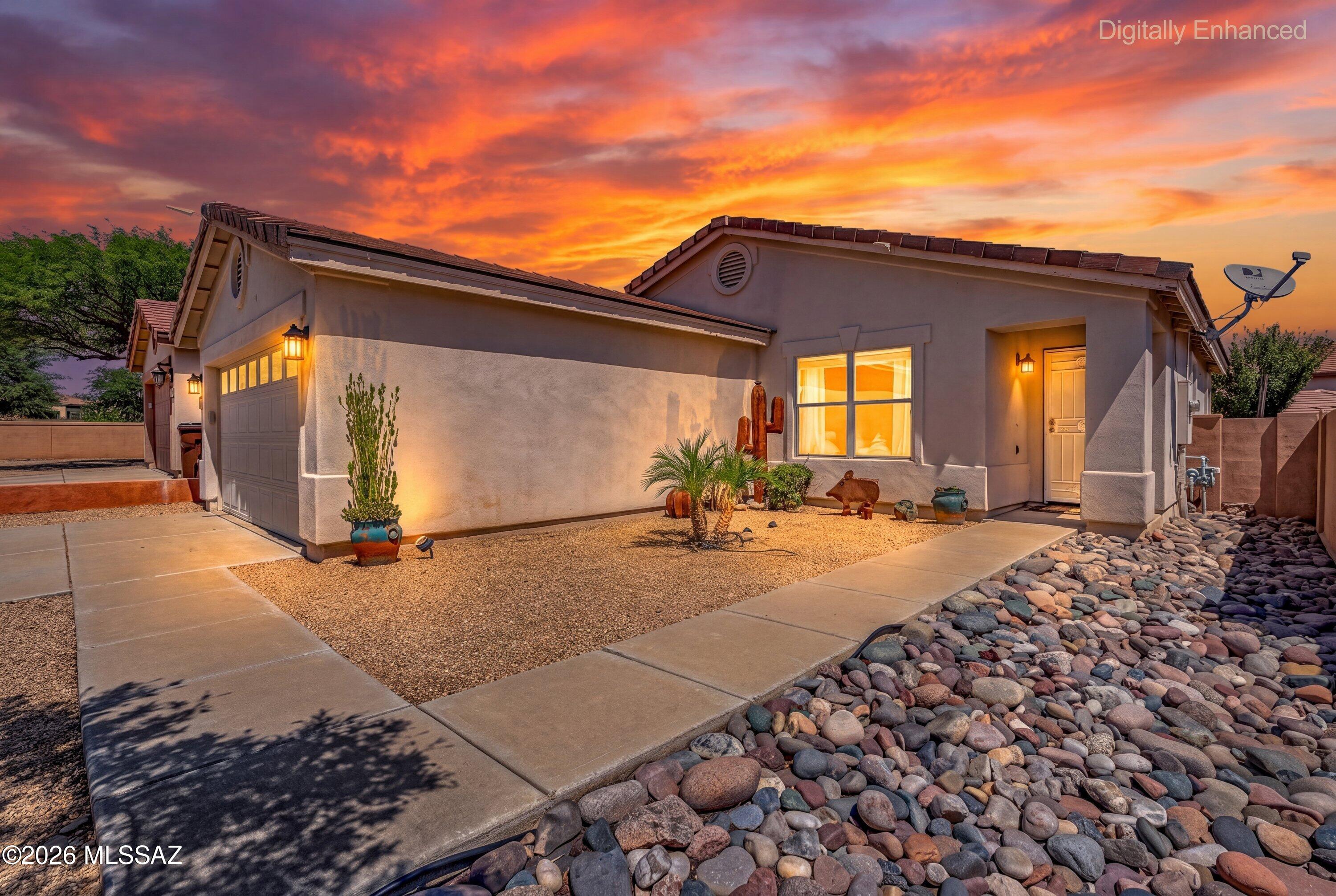 This single-story home offers just under 1,600 square feet with 3 bedrooms, 2 bathrooms, plus a versatile den/flex space perfect for a home office, playroom, hobby space, home gym and more. The functional floor plan features an extra-large living room filled with tons of natural light, creating a bright and inviting main living space. The kitchen features quartz countertops and flows easily into the living areas, making great use of the space while keeping the home comfortable and easy to maintain.
Step outside to a fully landscaped backyard featuring artificial turf and a gazebo, creating a low-maintenance outdoor space ready for relaxing, entertaining or enjoying Arizona evenings. Located in the award-winning community of Rancho Sahuarita, this home is ideally situated near Sahuarita Lake, Club Rancho Sahuarita and many of the community's most loved amenities. Enjoy scenic walking trails, fishing at the lake, the fitness center, Splash Park, multiple pools, playgrounds, green spaces and so much more.
Offering an excellent combination of location, amenities, functionality and value, this home is a wonderful opportunity to enjoy everything the Rancho Sahuarita lifestyle has to offer at an attractive price point. Whether you're searching for a place to call home or considering an investment property, there is a lot to appreciate here!
