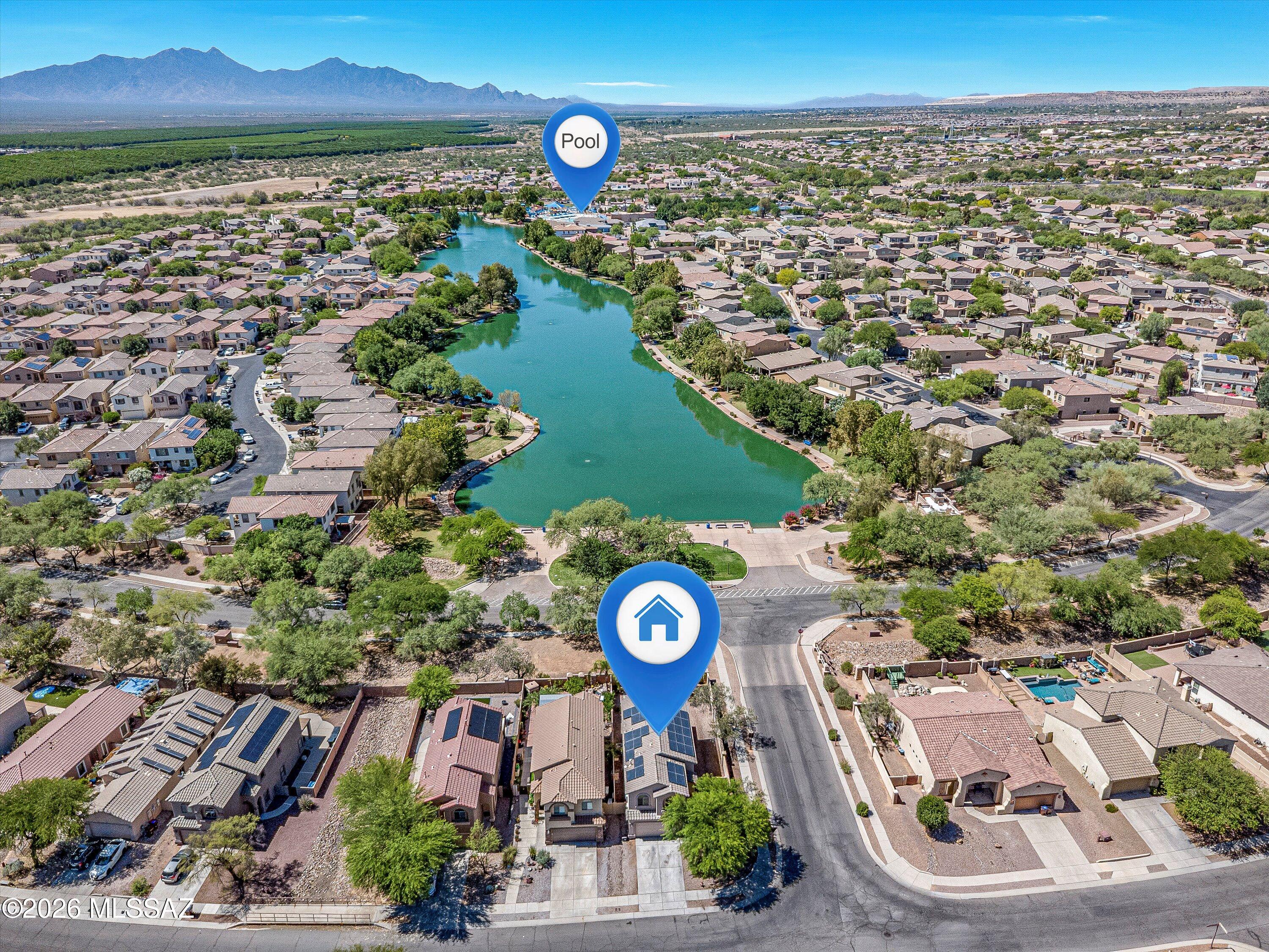 PRICE IMPROVEMENT + $10,000 SELLER CONCESSION! Discover exceptional value in this beautifully maintained Rancho Sahuarita home, ideally positioned on a premium corner lot directly across from Sahuarita Lake. Enjoy beautiful lake views from the primary suite and guest bedroom, along with the convenience of being just moments from the clubhouse, resort style pool, water park, pickleball, basketball courts and 25+ miles of paved trails.

The thoughtfully designed 4 bedroom, 2.5 bathroom floor plan offers comfortable living and entertaining spaces, a well appointed kitchen, custom coffee and wine bar, abundant storage and a spacious primary suite. Recent improvements include a 2024 HVAC system with transferable warranty, 2025 microwave and gas oven installed in June 2026. Step outside to enjoy the Arizona lifestyle with a covered patio, ceiling fan, wireless speakers, roller sun shade and a backyard with room for play or basketball. The 2 car garage adds valuable storage and functionality.

Seller is offering $10,000 in seller concessions toward allowable closing costs or a rate buydown. With its lake views, premium location, thoughtful updates and access to Rancho Sahuarita's exceptional amenities, this is a wonderful opportunity to enjoy the lifestyle you've been waiting for.
