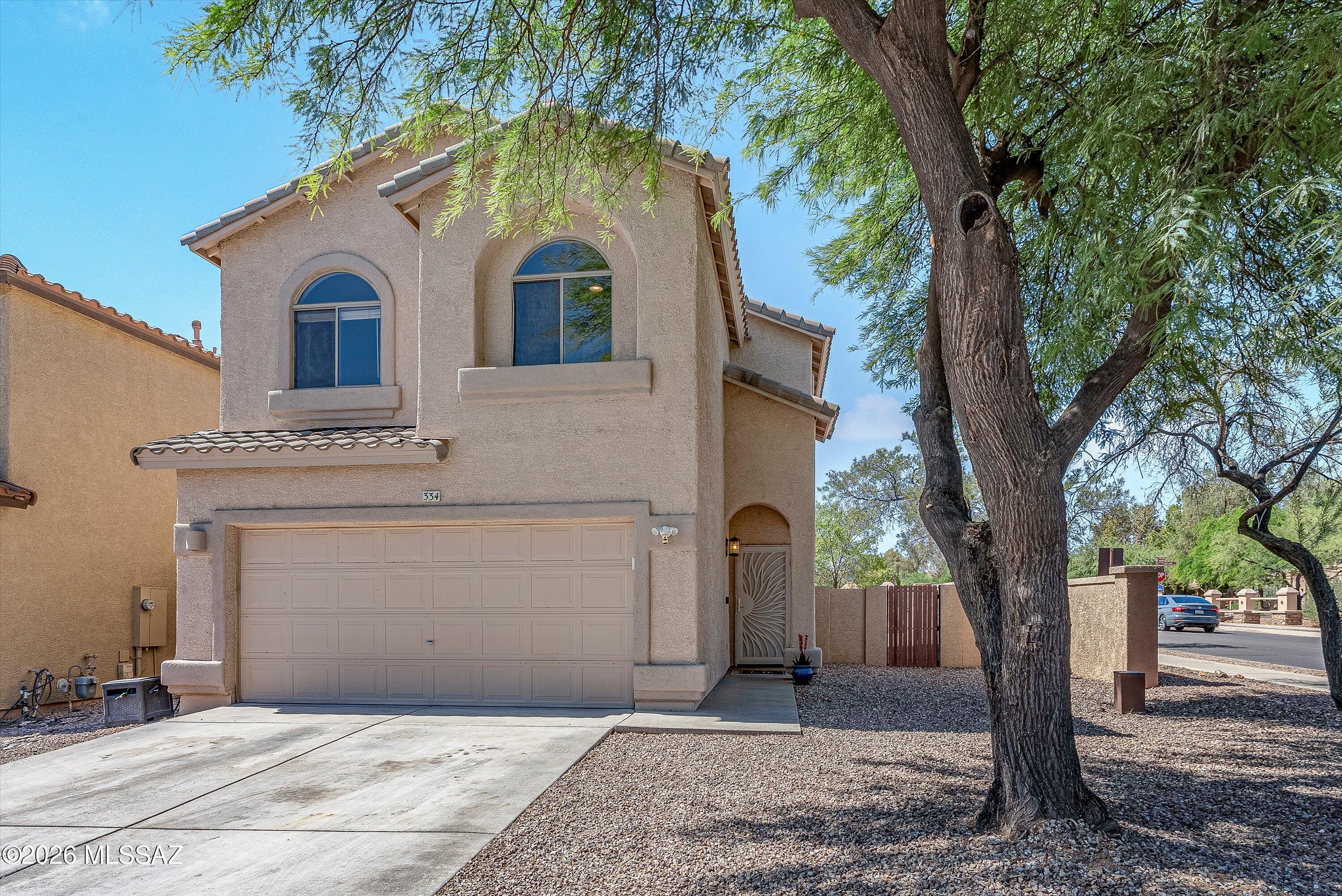 Dreaming of lake views while enjoying Arizona desert living? This exceptional home offers the perfect blend of location, lifestyle, and community amenities in the heart of Rancho Sahuarita.  Ideally situated on a premium location near Sahuarita Lake, enjoy beautiful lake views and convenient access to everything this sought after master planned community has to offer. Just a short walk to the clubhouse, resort style pool, water park, pickleball courts, basketball courts, and access to over 25 miles of paved walking and biking trails.  Inside, this well maintained and move in ready home features thoughtful updates and energy conscious improvements, including a newer HVAC system installed in 2024 with a transferable warranty, newer microwave in 2025, and a brand-new gas oven installed in June 2026. The dining area has been enhanced with added closet storage, with even more storage conveniently located under the stairs to maximize functionality.  Step outside and enjoy a backyard designed for both relaxation and fun with plenty of space to run, play, or even shoot hoops. The covered patio creates the perfect entertaining space and features a ceiling fan, wireless speakers, and a roller sunshade for year-round enjoyment and comfortable outdoor living. A higher block wall adds additional privacy.  Additional highlights include a custom coffee and wine bar that creates the perfect space for morning coffee or evening entertaining, leased solar($142/month) to help reduce monthly energy costs, plumbing already in place for a future water softener system, ceiling fans in all bedrooms, living room, family room, and dining areas and a portable AC unit in the garage for added comfort and flexibility.  The spacious primary suite offers beautiful lake views and includes two additional wardrobe closets for expanded storage and organization.  Whether you are looking for lake views, community amenities, outdoor recreation, energy efficiency, extra storage, or an updated move in ready home, this property checks all the boxes. Opportunities like this in Rancho Sahuarita do not last long. Schedule your private showing today.  One of the seller's is licensed to sell real estate in the state of Arizona
