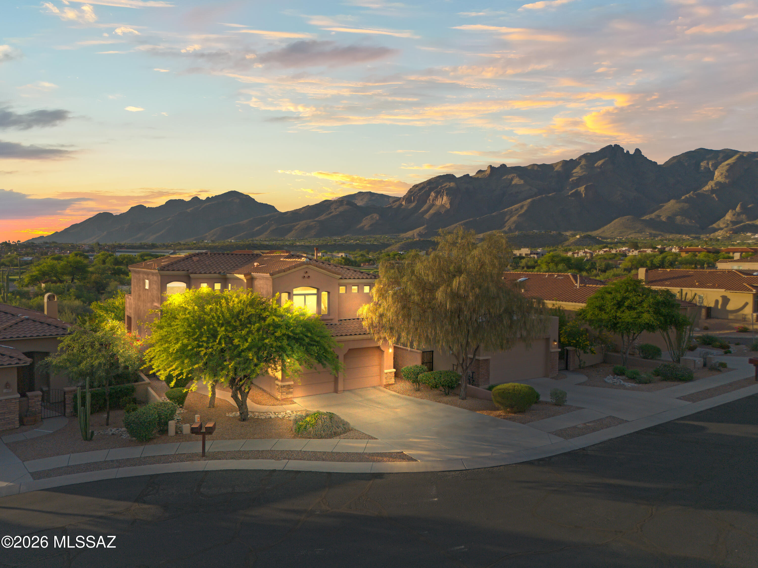 Beautiful Catalina Foothills home tucked away on a quiet street featuring soaring ceilings, abundant natural light, and spacious living areas throughout. The open-concept layout connects the great room, kitchen, dining area, and breakfast nook--perfect for entertaining. Enjoy a private primary suite with dual walk-in closets, flexible loft and den spaces, generously sized secondary bedrooms, and a 2-car garage. Conveniently located near shopping, dining, hiking trails, and top-rated schools with stunning desert and mountain surroundings.