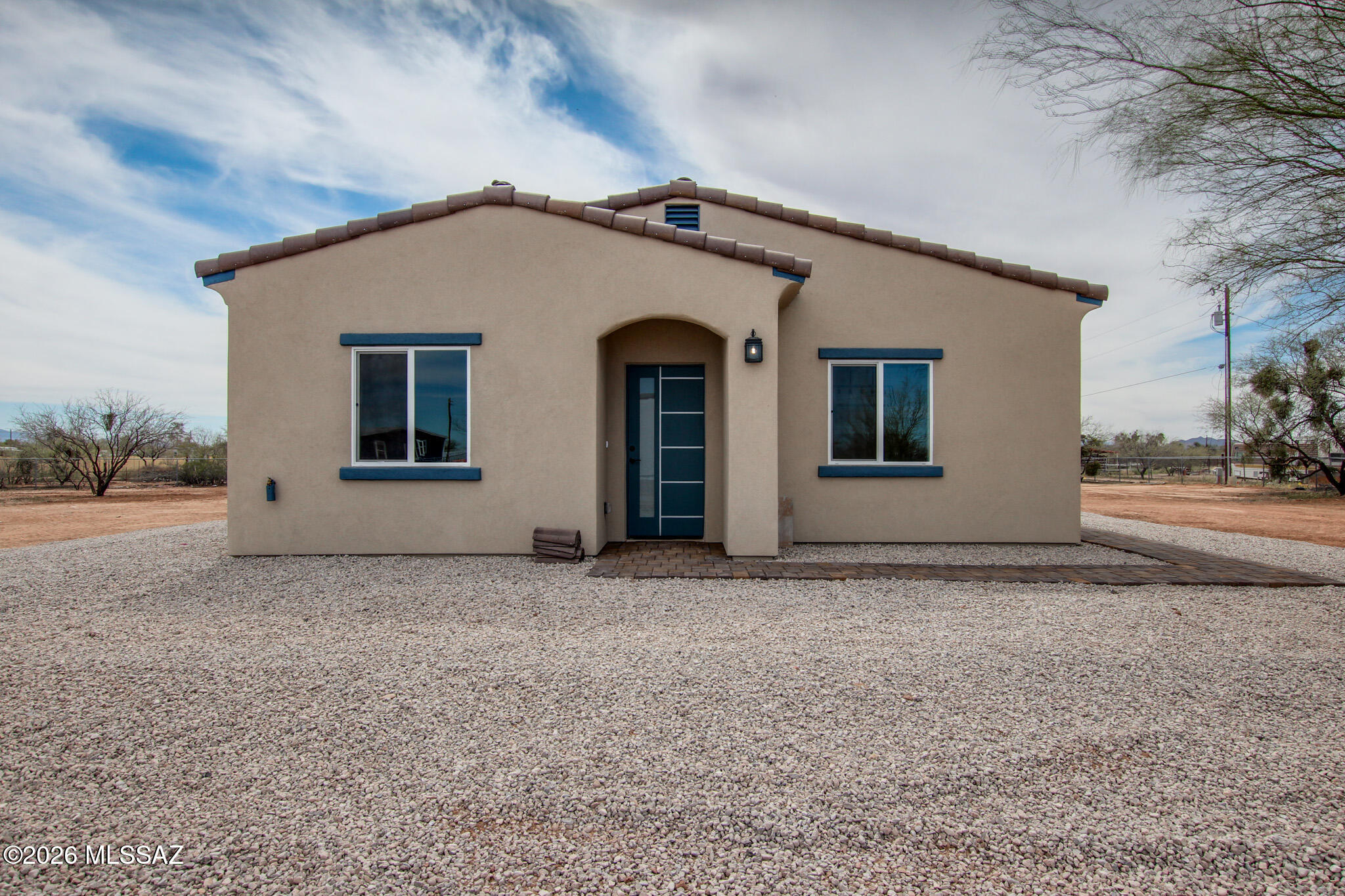 I am excited to share a rare opportunity for a new construction 2026 home on 1 acre in Marana. Located near El Tiro & Trico Rd in the desirable NW Tucson area, this 3-bed, 2-bath home offers stunning mountain views & freedom of no HOA. The property features an open-concept with ceramic tile throughout for modern, low-maintenance living. The spacious kitchen is equipped with granite countertops & ample cabinetry. The primary suite includes a walk-in shower designed for relaxation. Key features include: An acre with plenty of room for RV parking, horses, workshop, or guest house (buyer to verify). Connected to city water & serviced by septic. Situated in the highly sought-after Marana School District, access to I-10, shopping & dining. Don't miss this chance to enjoy Sonoran Desert living!