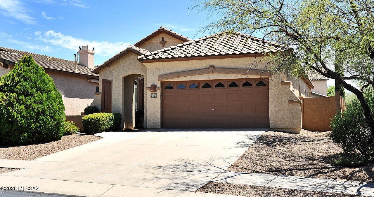 Gorgeous single story executive home in Oro Valley's Rancho Vistoso neighborhood. Premium lot on cul-de-sac bordering common area/natural desert. 4BR/2BA great room floorplan just with tile flooring throughout (no carpet). Kitchen has granite counters with breakfast bar, stainless appliances, pantry & desk area. Both bathrooms have been updated with granite counters. Primary suite features garden tub, separate shower, exec height vanity with double sinks, & walk-in closet. Great room features large picture window that frames the natural desert & sunset views to the West. Covered patio leads to an easy care back yard with view fencing. 2 car garage. Washer & dryer included.