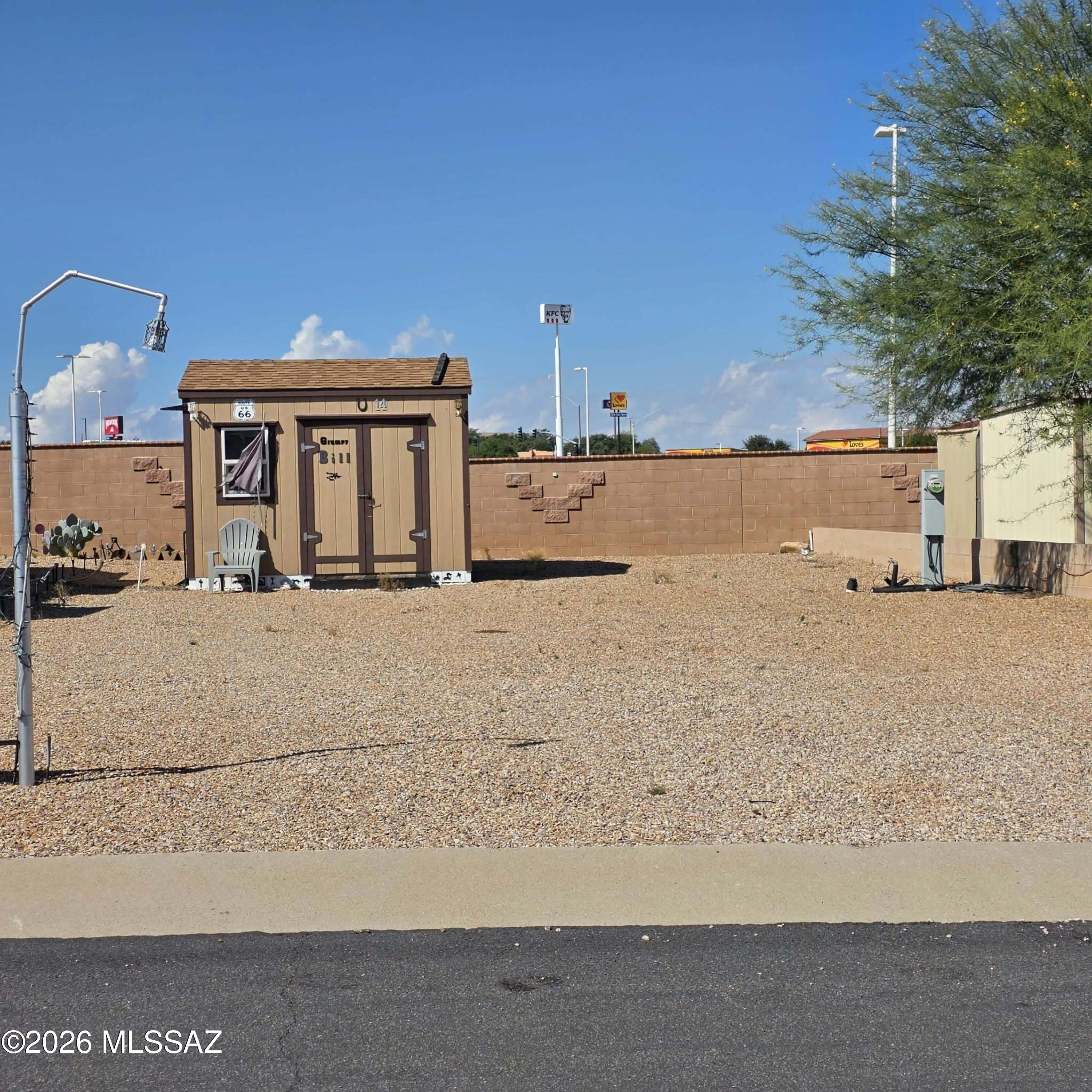 A welcoming 55+ community, Arizona Legends, offers outstanding amenities including a clubhouse, fitness center, library, laundry facilities, pool, and spa. With water, sewer, and trash included in the low monthly HOA fee, it's an affordable and hassle-free lifestyle. This lot includes a 10'x12' shed with power and with room to store all of your things.