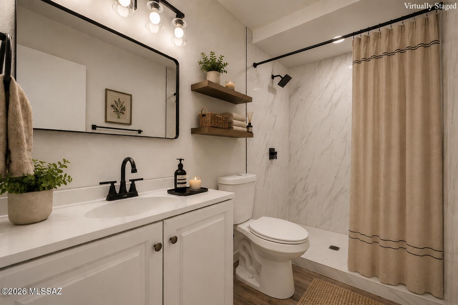 Home, sweet home! Tucked near the end of a cul-de-sac, this charming 2-bedroom home welcomes you with an inviting paver patio and tranquil water fountain. Inside, enjoy a completely renovated designer interior featuring vaulted ceilings, a soothing palette, blinds, stylish wood-look flooring throughout, and a beautifully updated luxury bathroom. The eat-in kitchen offers crisp white cabinets, butcher block counters, new appliances, and a pantry for added storage. Both bedrooms are well-sized, with the primary bedroom offering its own separate entrance for added convenience. The spacious and private wraparound lot is great for entertaining and includes covered parking, gated alley access, and a storage shed. No HOA. Priced to sell, come see it before it's gone!