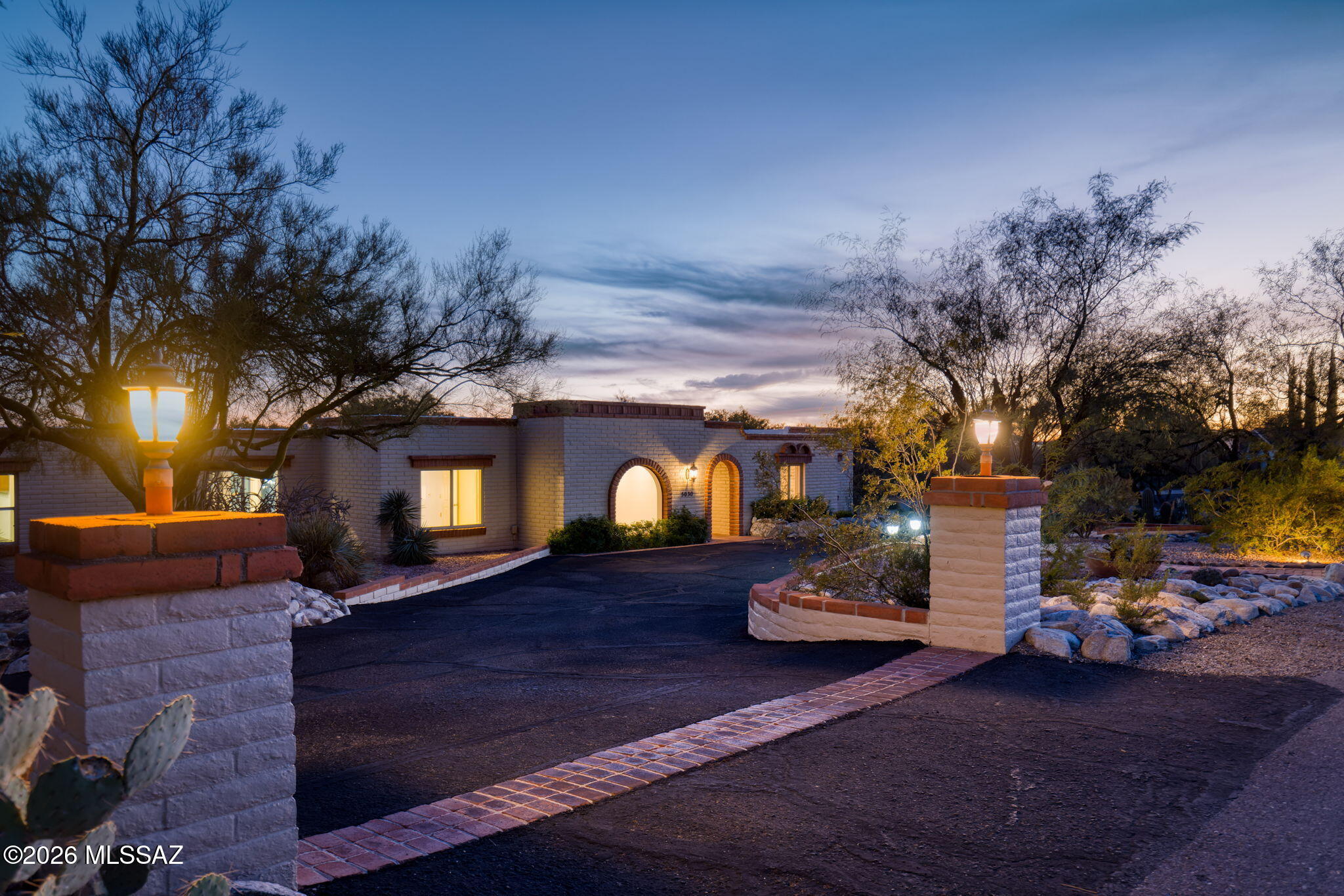 Located within the prestigious Skyline Bel Air Estates enclave of the Catalina Foothills, 5030 E Camino Bosque, Tucson, AZ 85718 represents a rare opportunity to own a beautifully upgraded luxury residence on an expansive .78-acre homesite. Spanning 3,142 square feet with 5 bedrooms and 3 bathrooms, this refined desert retreat blends sophisticated interior improvements with the tranquility, privacy, and scenic beauty that define one of Tucson's most desirable foothills communities. Skyline Bel Air Estates is a custom-home neighborhood known for elevated city and mountain views, large lots, and a peaceful desert setting surrounded by native flora and fauna. Residents enjoy access to neighborhood amenities including a swimming pool and tennis courts, further enriching the lifestyle appeal.

Beyond the neighborhood itself, the broader Catalina Foothills area is synonymous with upscale living  featuring prestigious resorts, golf courses, spas, shopping, dining, art galleries, and celebrated hiking destinations set against the Santa Catalina Mountains.

Inside the residence, extensive renovations create a polished, move-in-ready environment. A completely redesigned kitchen anchors the home with modern finishes and improved functionality, flowing effortlessly into newly retiled kitchen and living areas that deliver both visual continuity and durability. The living room is elevated by a custom tile fireplace renovation, providing a dramatic focal point ideal for intimate evenings or upscale entertaining. A fully remodeled third bathroom adds convenience and sophistication for guests and family.

The primary suite serves as a private sanctuary, enhanced with Hunter Douglas automated blinds that allow effortless control of natural light  an understated luxury that complements Tucson's spectacular sunrises and sunsets. Thoughtful upgrades continue throughout the home, including a closet expansion in the fifth bedroom, custom floating display shelves in every bedroom, select new ceiling fans, and a full interior repaint completed in 2023, delivering a fresh, contemporary aesthetic.

Outdoor living has been carefully curated to reflect the Arizona lifestyle. The expanded backyard showcases new turf and pavers for a clean, low-maintenance design ideal for entertaining beneath desert skies. A new irrigation system supports the landscaping, while the resealed driveway underscores the pride of ownership evident throughout the property.

Adding exceptional strategic value, the home includes professionally developed architectural plans for future expansion  envisioning a new dining room, a gym and laundry combination, and a large office with its own bathroom. Plans also propose enclosing the existing patio and constructing a new rear patio featuring an outdoor kitchen and viewing deck, perfectly positioned to capture the Foothills' sweeping vistas and indoor-outdoor lifestyle.

The home is served by the Catalina Foothills Unified School District, widely regarded as one of Arizona's top-rated districts, with schools frequently scoring 8-10 out of 10 on GreatSchools. Skyline Bel Air Estates specifically falls within the attendance boundaries for Sunrise Drive Elementary, Orange Grove Middle School, and Catalina Foothills High School.

Equally compelling is the location: Skyline Bel Air offers proximity to La Encantada and other Foothills conveniences, combining serene residential living with access to upscale retail and dining. The neighborhood itself is often described as beautiful, peaceful, quiet, and rich in scenery and wildlife, making it especially appealing to those seeking both luxury and connection to nature.

With its generous acreage, extensive upgrades, architectural potential, and placement within a distinguished Foothills community, 5030 E Camino Bosque delivers a compelling blend of elegance, comfort, and long-term value  a home designed not only for elevated living today, but for an exceptional future.