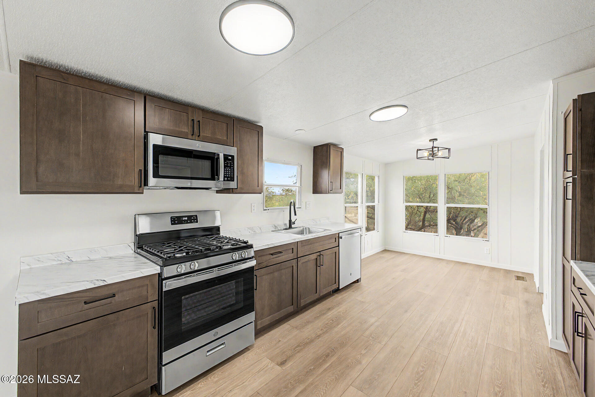 Now Available! Updated manufactured home. Recent upgrades include luxury plank flooring, new carpet, updated electrical fixtures, door hardware, and a brand-new Roof.  Kitchen features warm brown cabinets, new countertops, and stainless steel appliances. Bathrooms tastefully updated.  Interior and exterior updated with fresh paint. Move-in ready and a must see!