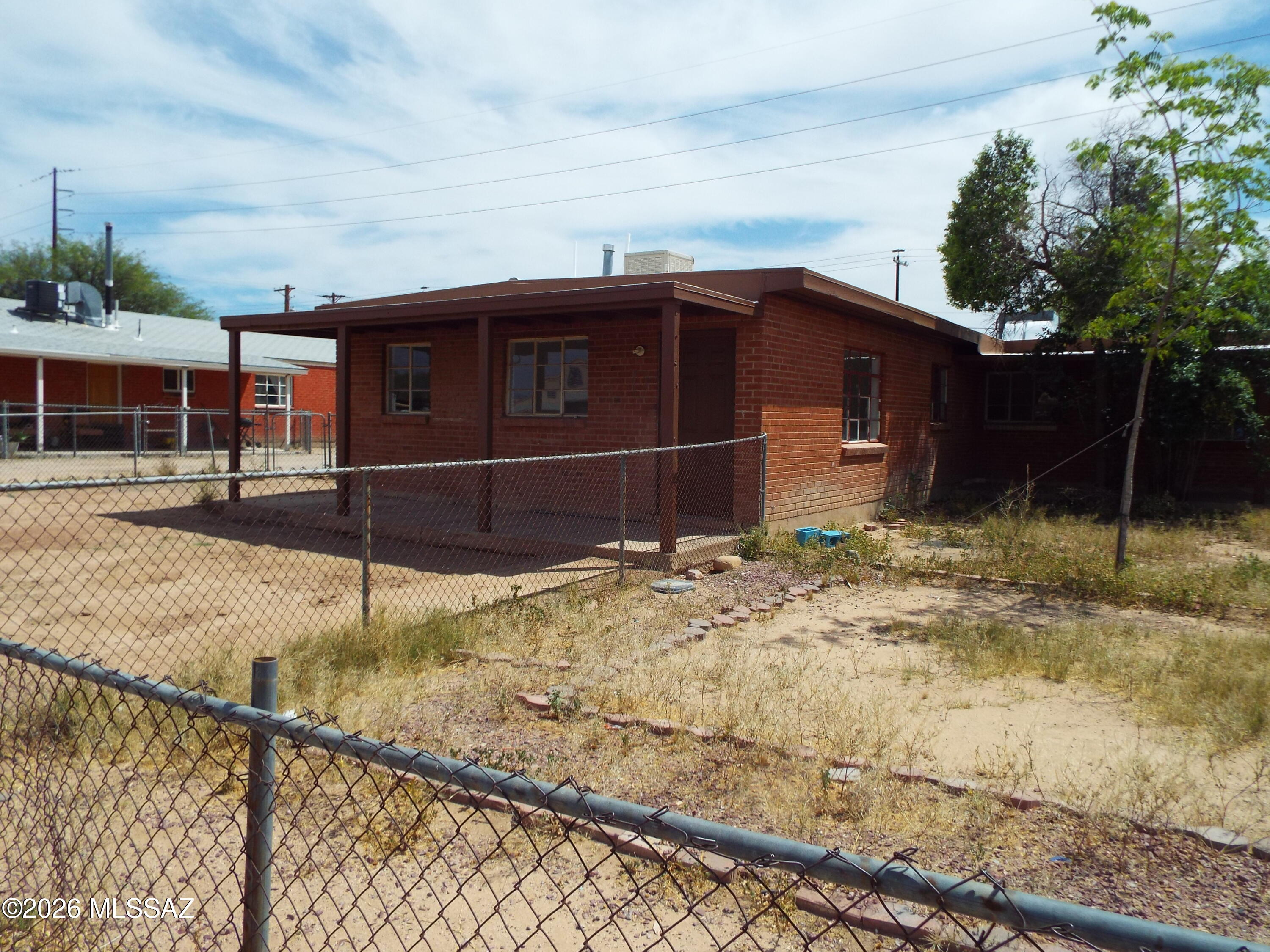 Many improvements, recently painted, excellent location near Swan.  Live in one side rent the other. Large fenced in yard for both units.  Plenty of natural light.  Tile throughout, Pictures wont do it justice.  Come see it you wont be disappointed.  One Unit has AC the other just had new mini splits installed.  The sq footage and expense figures are approximate figures.  There is a new water heater that was just  installed in one of the units.