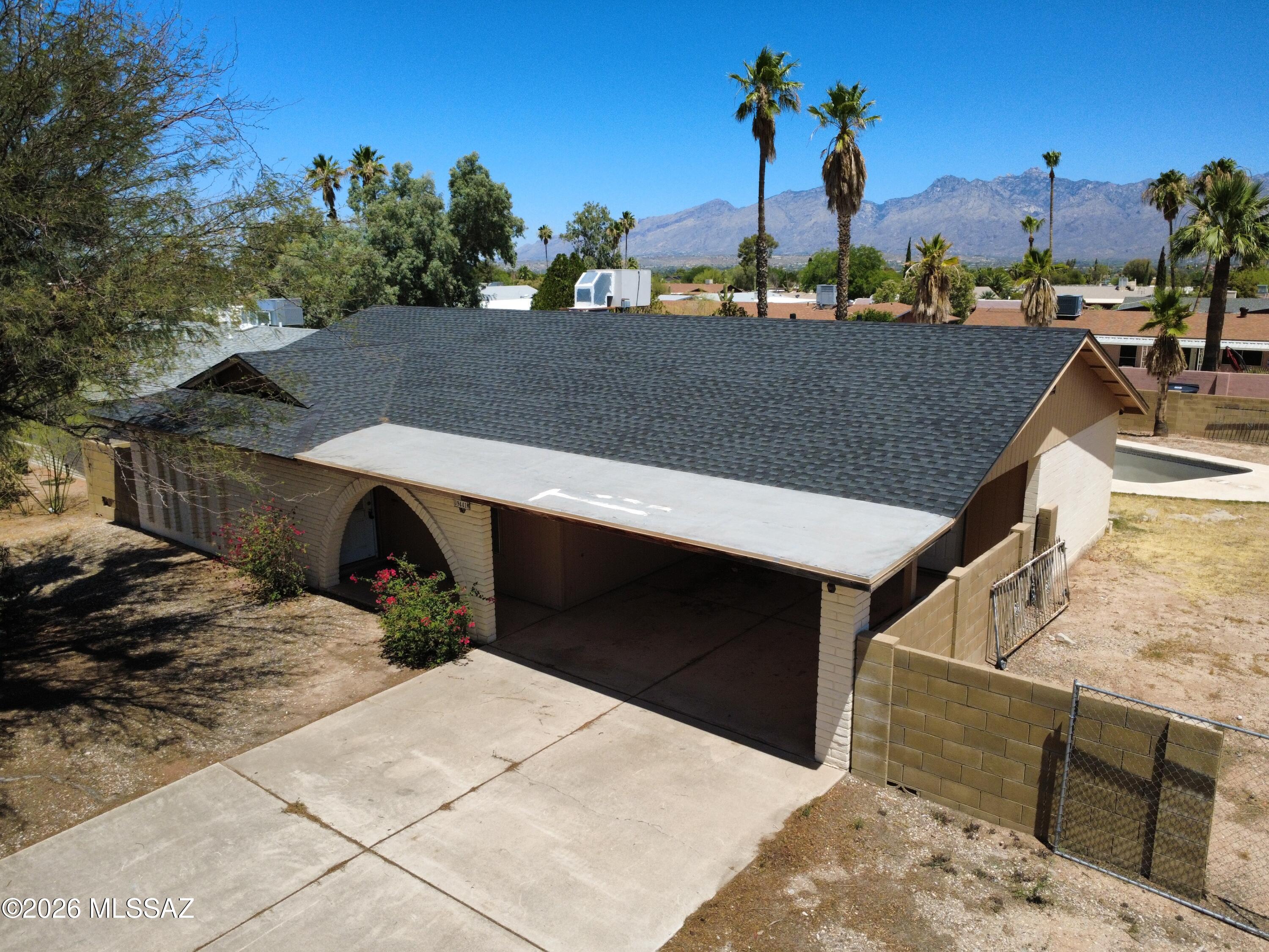 Great opportunity to own a HUD Home, save thousands! Located on a large corner lot with stunning mountain views! This spacious home features a versatile floor plan with a formal living room and separate family room that opens to the dining area and kitchen, creating the perfect space for everyday living and entertaining. The primary suite features a large walk-in closet. Both bathrooms have been remodeled with tile-surround showers. Step outside to a private backyard with pool, covered patio, and space to relax and enjoy the outdoors. Owner Occupant bidders only for the first 5 days on the market. Please see attached MLS Addenda for property specific disclosures & repairs. Bidding on a HUD Home is quick & easy! Buyers or agents please call for help with any part of the bidding process.