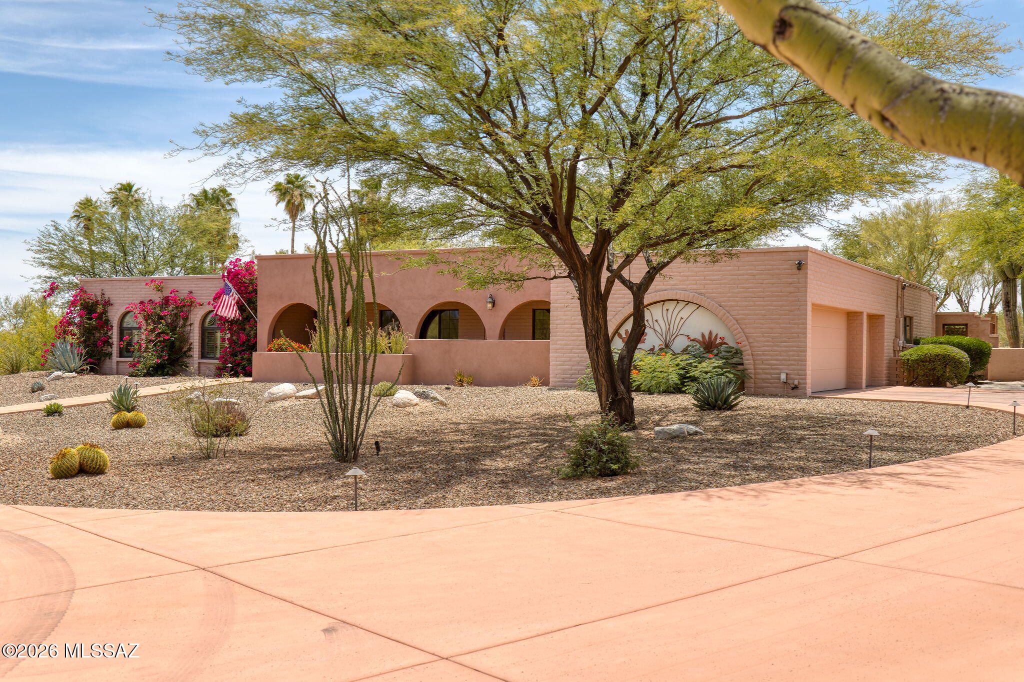 Incredible hilltop retreat with sweeping Rincon and Catalina Mountain views in sought-after Sabino Vista Heights! Beautifully maintained and thoughtfully updated, this exceptional residence is surrounded by mature desert landscaping and peaceful natural beauty. A Governors painted concrete driveway leads to the stately home. Welcoming courtyard entry with water feature is the perfect place to enjoy spectacular sunrise views over the Rincon Mtns. Inside, polished & etched concrete floors flow throughout the spacious home. Hand painted border adds a touch of flair in the living/dining rooms. The chef's kitchen features cherry cabinetry, granite countertops, GE Monogram stainless appliances, oversized granite island, 6-burner gas cooktop, double ovens, & two dishwashers for added convenience! Expansive family room connects seamlessly to the outdoor living areas, creating ideal indoor-outdoor flow. The flexible floor plan includes spacious guest quarters with living area and prep kitchenette with sink, offering versatile options for guests, workspace, hobbies, or extended stays. The private backyard is designed for enjoying Tucson's year-round lifestyle with a deep covered patio, outdoor kitchen with gas BBQ, hood vent and sink, sparkling pool and spa, and tranquil desert surroundings where deer and native wildlife are occasional visitors outside the view fence. A charming gazebo with fireplace perfectly frames breathtaking Catalina Mountain views, creating an unforgettable setting for relaxing evenings and outdoor entertaining.
All "extra large" outdoor potted plants convey. All office furniture and bookcases in Bedroom 3 convey. Most other furniture is available for purchase on a separate bill of sale.
Exceptional privacy, stunning mountain views, and outstanding indoor-outdoor living space complete this remarkable desert retreat, conveniently located near Fruchthendler Elementary School, BASIS Tucson North, Whole Foods Market, popular dining and shopping, and Sabino Canyon Recreation Area. Make this gem your home sweet home today!