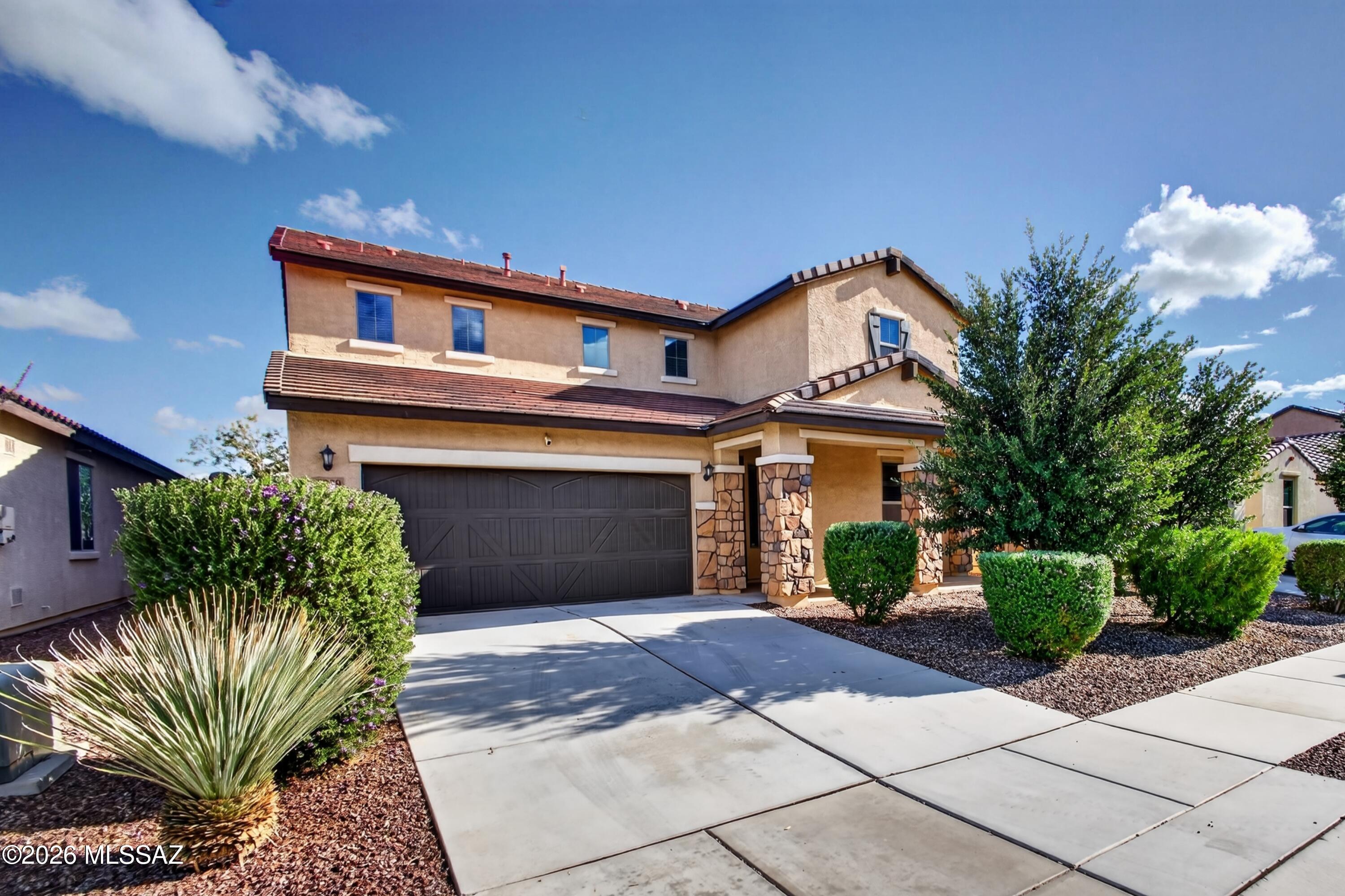 Beautifully maintained and move-in ready! This stunning Meritage home in La Estancia, located in the Vail School District, offers 4 bedrooms, 2.5 baths, and a versatile downstairs den. Gorgeous tile floors complement the spacious, open-concept living area, perfect for entertaining. The kitchen features a large island, stainless steel appliances, a NEW refrigerator, and walk-in pantry. Recent upgrades include a reverse osmosis system and whole-house water filtration system. Upstairs, enjoy a spacious primary suite with dual vanities and a generous walk-in closet. Step outside to a beautifully landscaped backyard featuring artificial turf, pavers, and a fire pit, with no neighbors directly behind. Pride of ownership shines throughout this exceptional home!