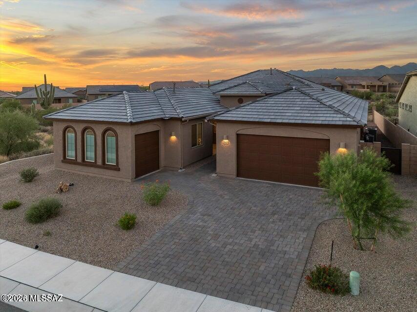 This spacious, unfurnished single-level home in a gated community is available to rent at $3450 per month. Owner will pay HOA fees, landscaping maintenance, internet/wifi, and water up to $100 per month, and tenant will pay all other utilities. The Evolution floor plan features a main house with an open living/kitchen/dining area, large den, 3 bedrooms and 2 baths. The attached Next-Gen® 600 sqft suite has a private entrance, living area, kitchenette, bedroom and bathroom, providing an ideal space for guests or extended family. The additional separate 1-bay garage is perfect for an extra vehicle or bicycles/toys. The home is situated in the Preserve at Twin Peaks on a desirable lot with scenic desert open space bordering the back and one side.  Peaceful neighborhood, with two playgrounds! Numerous upgrades including premium cabinets w/roll-out trays, granite countertops, a variety of smart home features including Wi-Fi-enabled deadbolts, thermostats, and garage openers. Pets considered, up to 2 dogs.  Overnight street parking is not allowed, and smoking is prohibited.