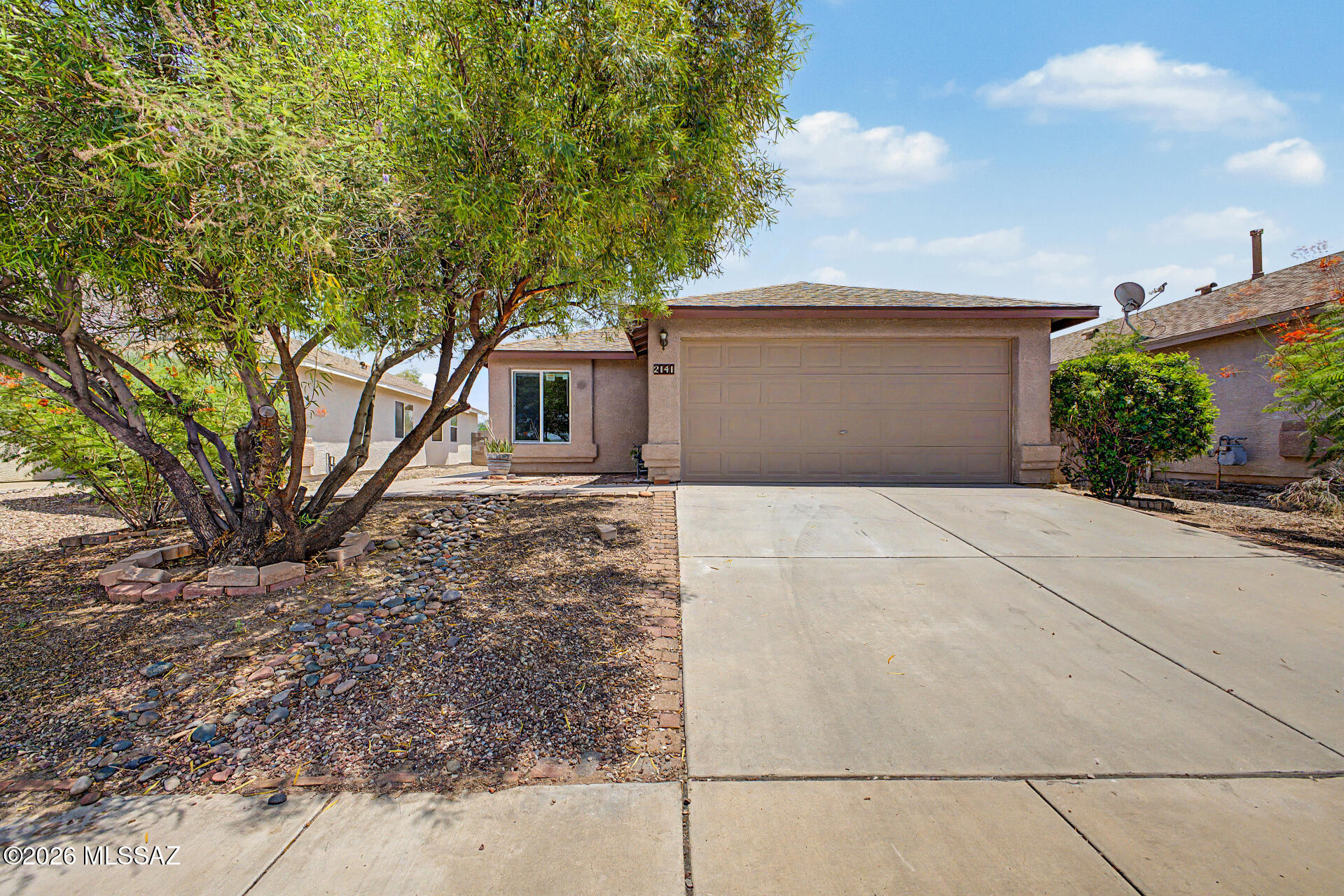 Beautifully updated 3 bedroom, 2-bath home and modern upgrades, an unbeatable location & peaceful mountain views. Recent improvements include a newer HVAC system, new roof, fresh interior / exterior paint, & new flooring throughout, providing comfort and peace of mind for years to come. Inside, you'll find an open, inviting layout with abundant natural light, a spacious living and dining area, and a stylish kitchen featuring quartz countertops, freshly painted cabinetry, a pantry, and SS appliances. The primary suite offers a walk-in closet and private bath, while the covered patio overlooks a backyard with no rear neighbors, creating a private setting to relax and enjoy the surrounding mountain views. Conveniently located near Tucson Marketplace, shopping, i10 & downtown Tucson