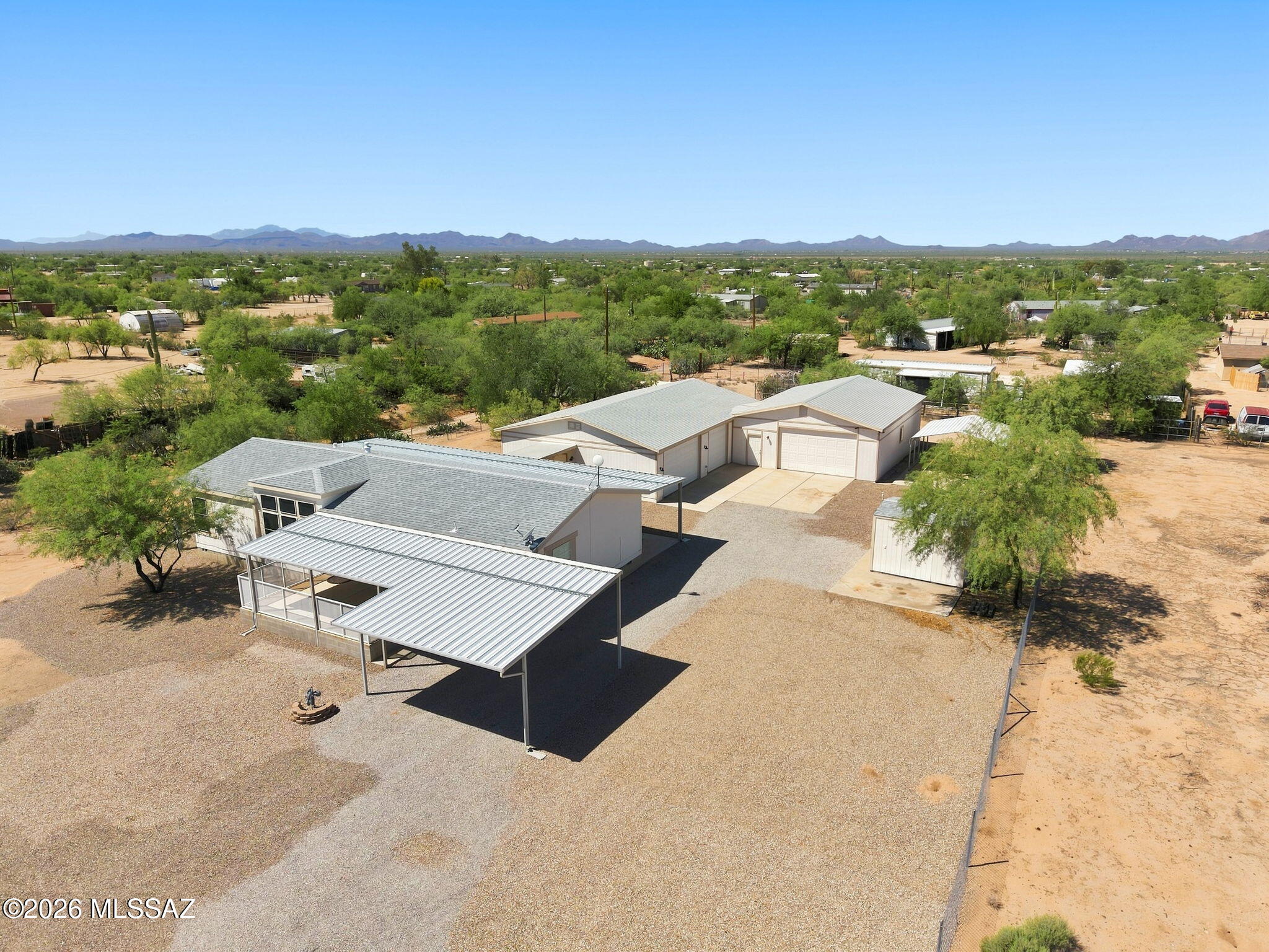 Welcome to this spacious 3-bedroom, 2-bath home built in 2006, offering 1,680 square feet of comfortable living space on a generous 1.2-acre lot. With room to spread out and plenty of space for all your toys, this property is the perfect opportunity for those looking for country-style living with exceptional storage and garage space.
Step inside to find vaulted ceilings that create an open, airy feel, along with a formal living room and a separate family room--giving you plenty of space for entertaining, relaxing, and everyday living. The home features a one-year-old roof and a three-year-old HVAC system, providing valuable peace of mind.
One of the standout features of this property is the two garages totaling an impressive 1,800 square feet.  See more Garages are insulated and cooled, making them ideal for a workshop, car collection, business use, storage, or whatever your imagination can dream up.

Outside, enjoy the fenced-in yard with an electric gate, offering privacy, security, and convenient access. With 1.2 acres, there's plenty of room for RVs, boats, trailers, off-road toys, and more.

If you've been looking for a home with acreage, comfortable living space, and incredible garage capacity, this property is a must-see!