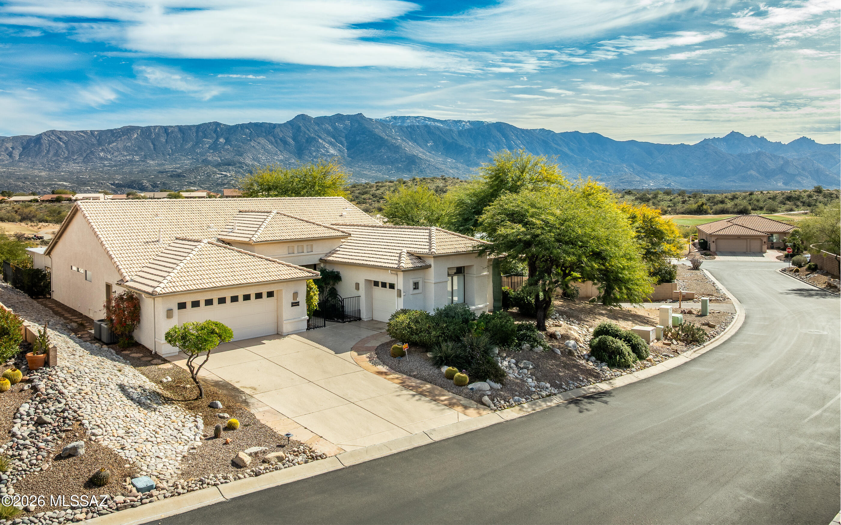 Ideal location and orientation - lovely Catalina Mountain, nature and golf cart views. Very private location for this Dakota floor plan- extra privacy on south side. Highly desired full golf cart garage. Very spacious open gourmet kitchen w/granite countertops + all appliances conveying. Cozy and relaxing fireplace in family. room. Gaze into lovely views from a plethora of large scale windows. Enjoy your backyard oasis under the stylish Pergola and ever so peaceful and beautiful Koi pool.  Home also hosts beautiful mature citrus trees. Single story living - spacious floor plan - lovely views-gated front courtyard and nice privacy. Abundant tile flooring throughout home along with beautiful planation shutters. Home is ready for quick move-in. Golf cart is available on separate Bill of Sale. Additional information and commentary: If mature Koi fish are not desired to remain in the pool/water feature, then seller will arrange transport to a professional Koi organization prior to COE  to ensure their safety and a long, enjoyable life. Automatic feeder will also be removed. A window glass replacement estimate has been provided by Sharp Glass for the failed thermopane seals on several windows. The bid is provided in MLS Documents and is negotiable.