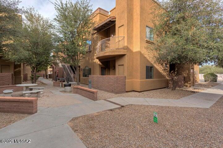 Fully furnished ground-floor 2-bedroom, 2-bathroom condo ideally located near River and Campbell in the highly desirable Placita Escondida community. The spacious primary suite features a large walk-in closet and private patio access, creating a comfortable retreat. The living room, dining area, kitchen, and bathrooms showcase tile flooring, while both bedrooms offer stylish wood-look plank flooring. Whether you're looking for a primary residence, a second home, or an investment opportunity, this condo is an excellent choice and offers great potential as a short-term rental.